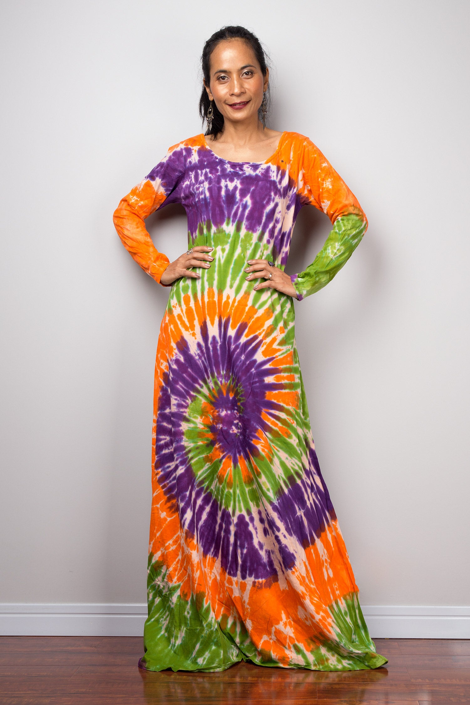 Small ice dye tank dress with buy blue, orange, and purple swirl design. Soft cotton hi-low hem rainbow tie dye.