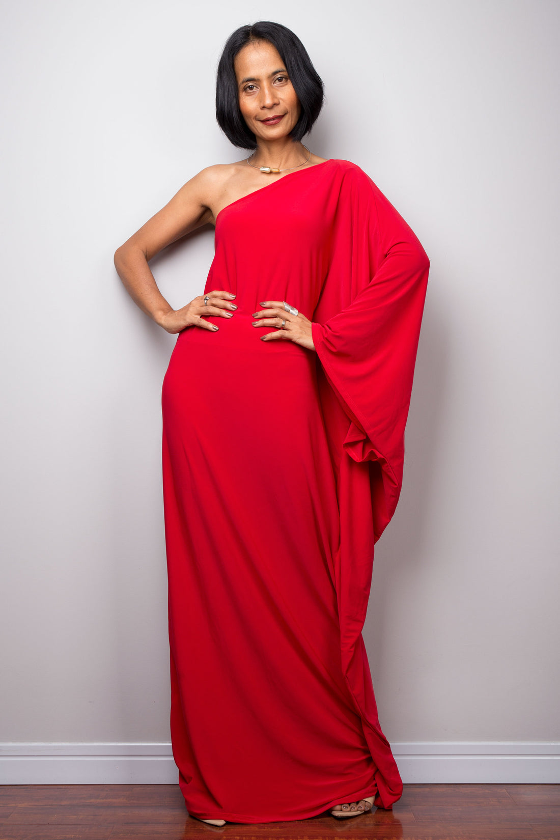 Red one shoulder dress by Nuichan.  Asymmetrical dress which can be worn on either shoulder