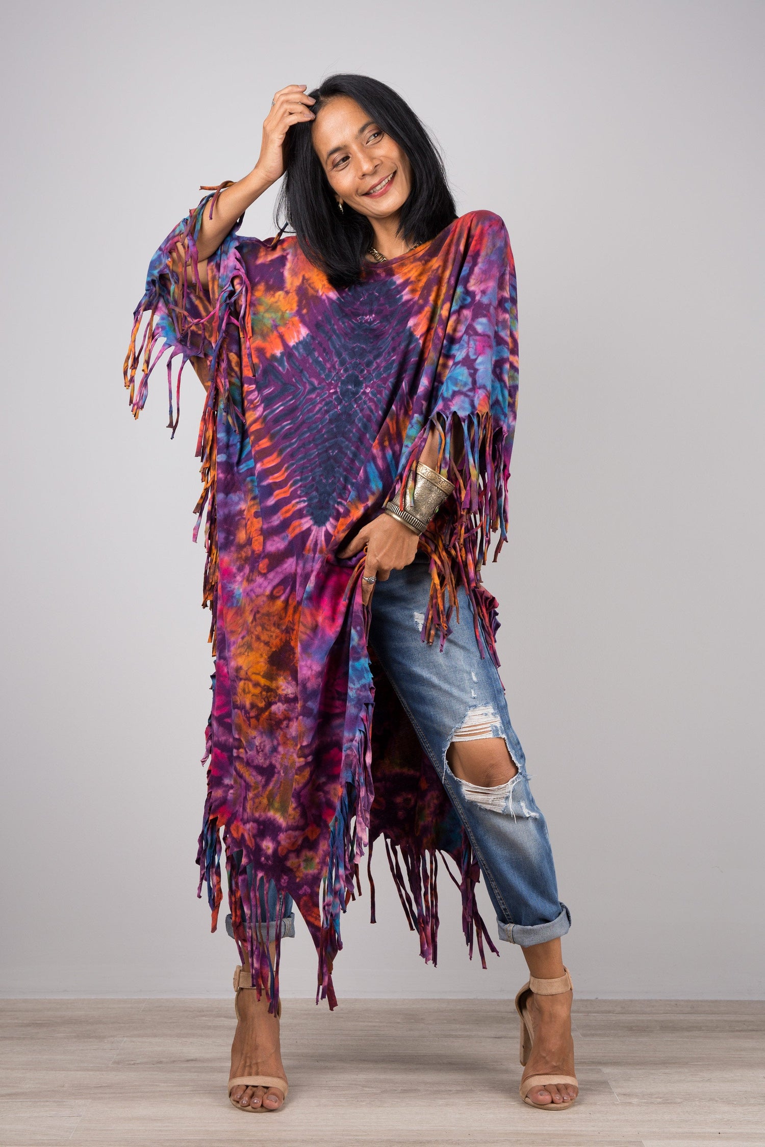 Purple and orange tie dye poncho with fringes on the hem