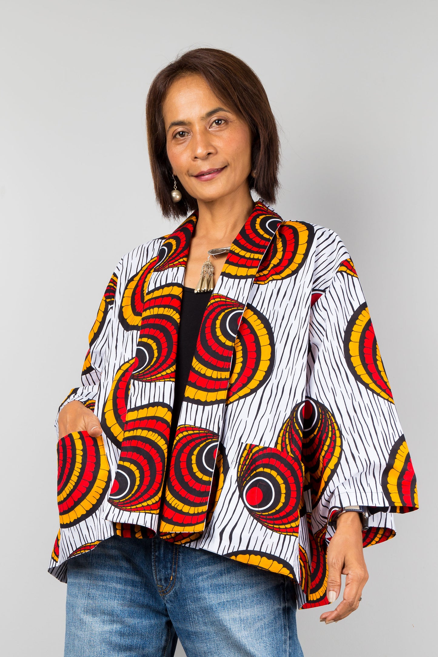 African kimono jacket top.  Short jacket top in ankara fabric. Waist length jacket with two pockets