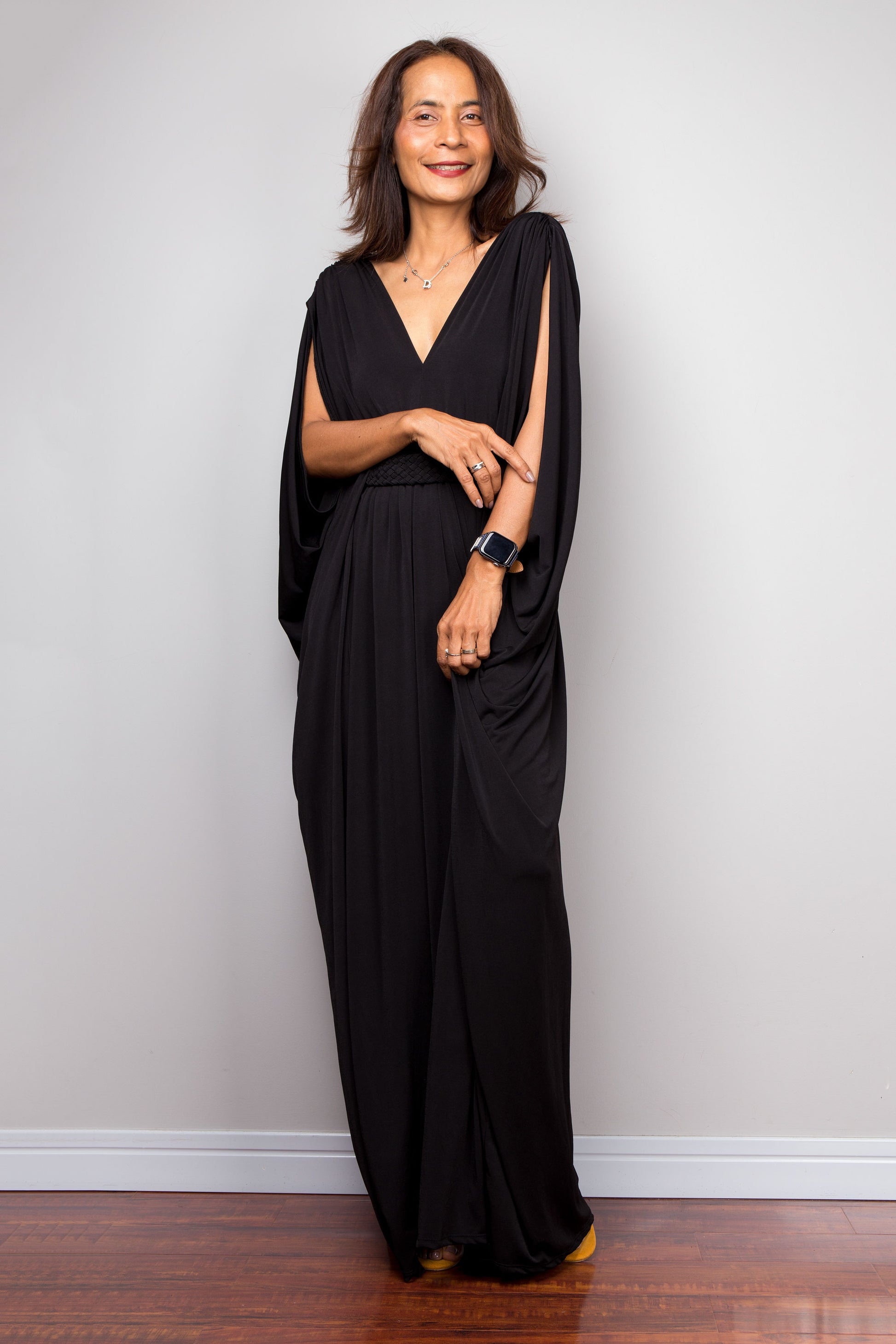 Long chic black kaftan dress with v neck and braided detail on the waist