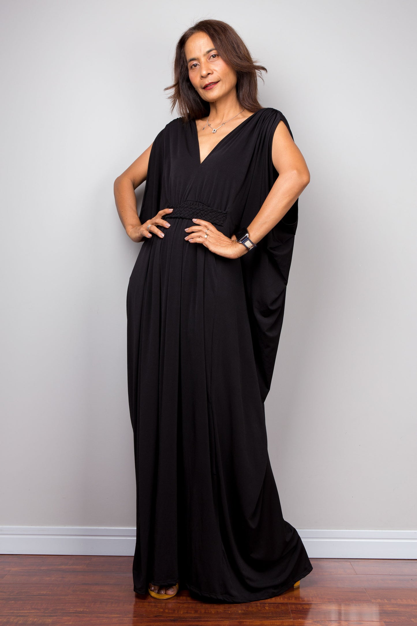 Long black caftan dress with v neck and braided detail on the waist.  Batwing sleeve dress by Nuichan