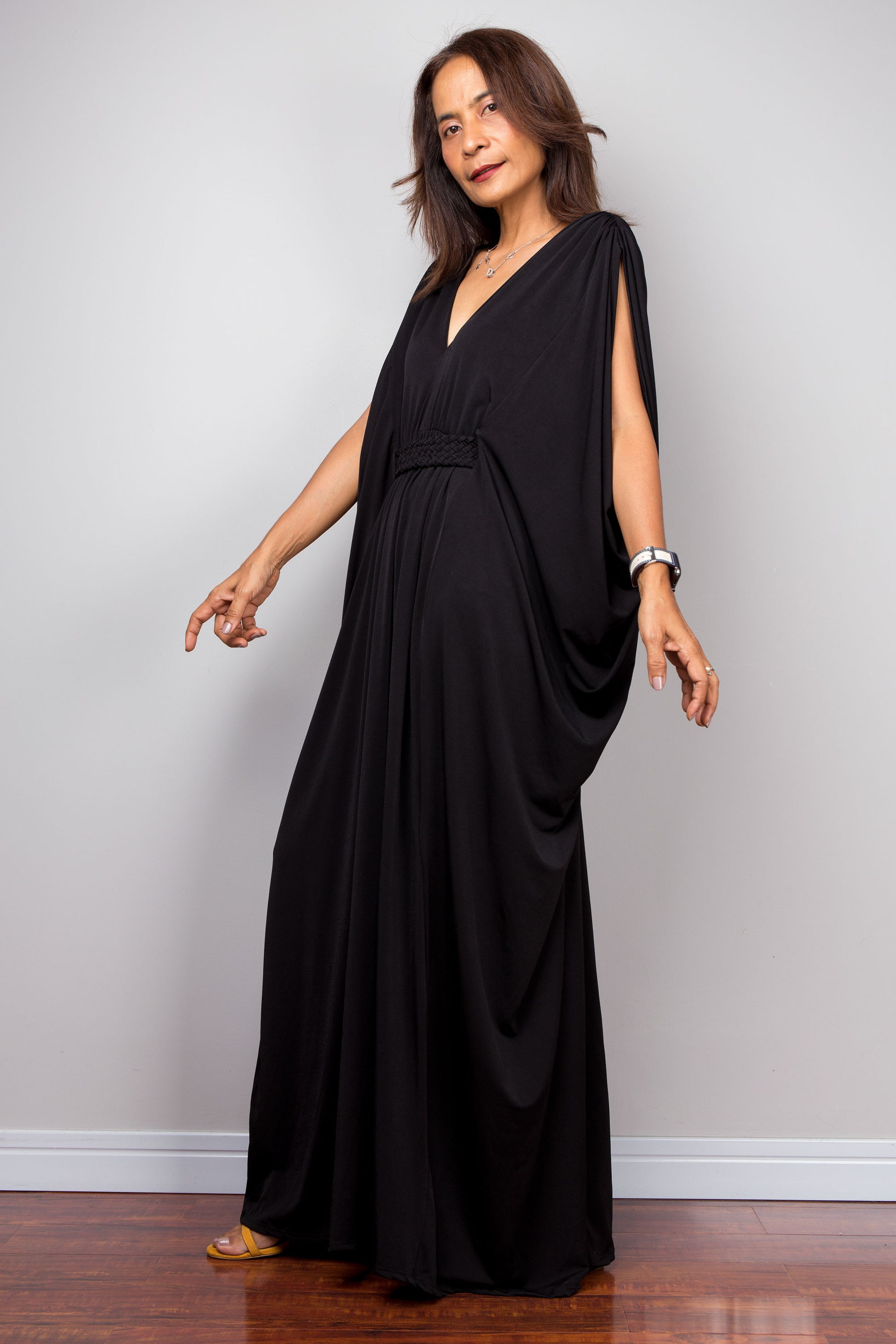 Chic black kaftan dress with v neck and braided detail on the waist by Nuichan