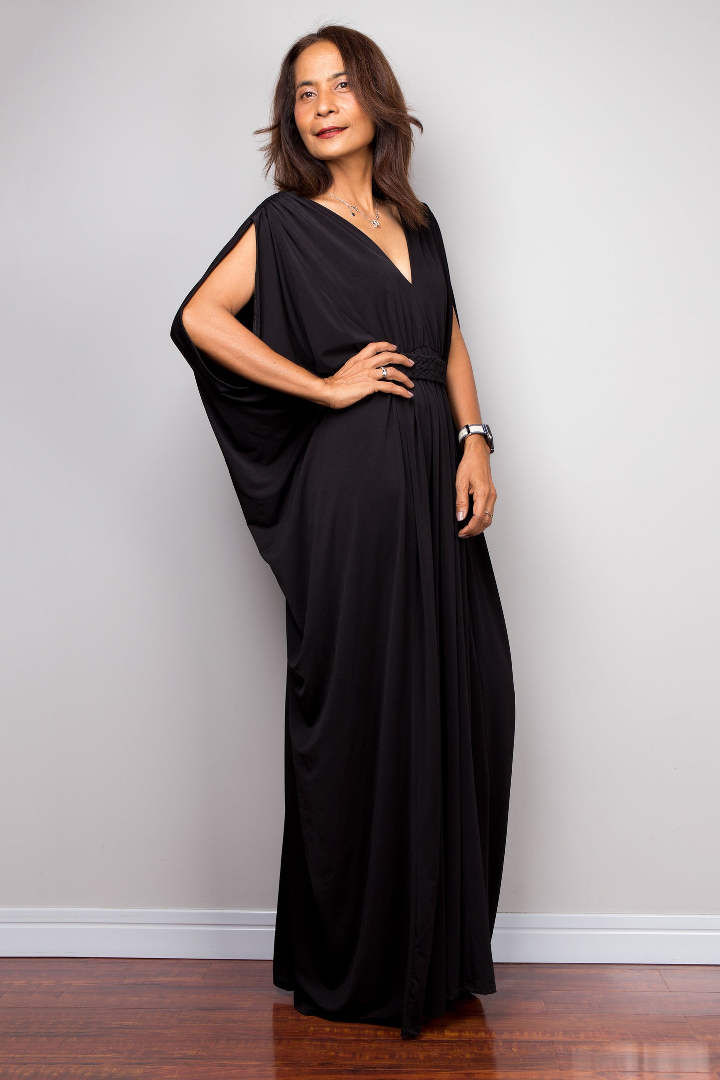 Elegant black kaftan dress with v neck and braided detail on the waist