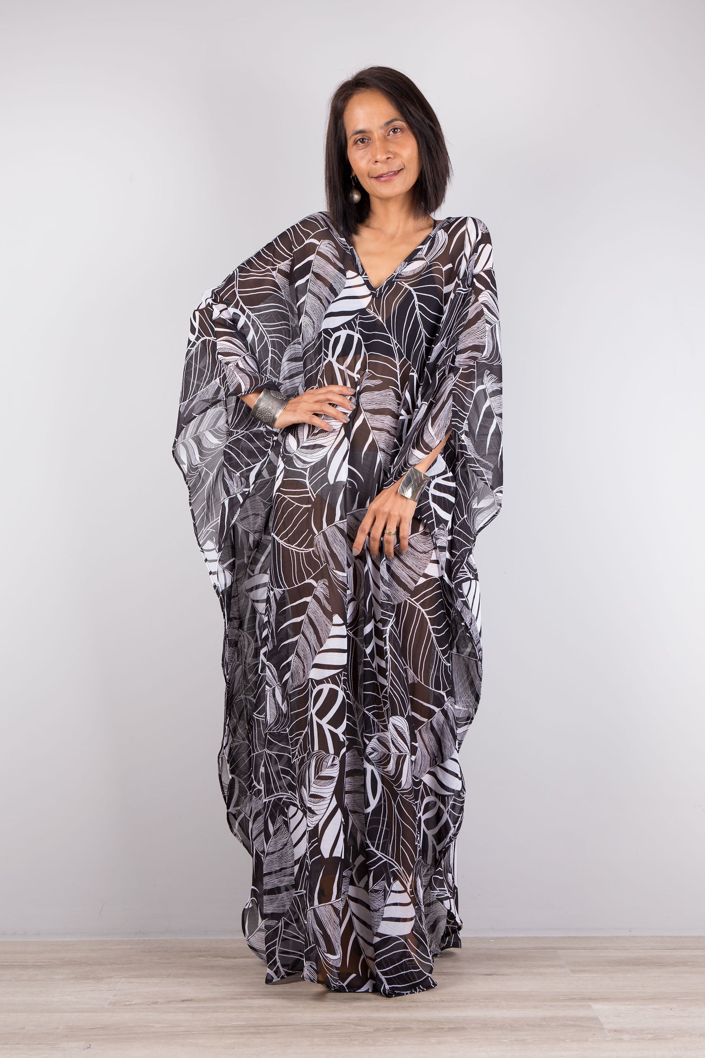 Chiffon kaftan dress in black and white. Loose fit caftan with subtle v neck and batwing sleeves