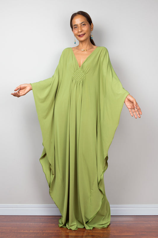 Fern green kaftan dress with plunging neckline, model showing batwing sleeves - front view