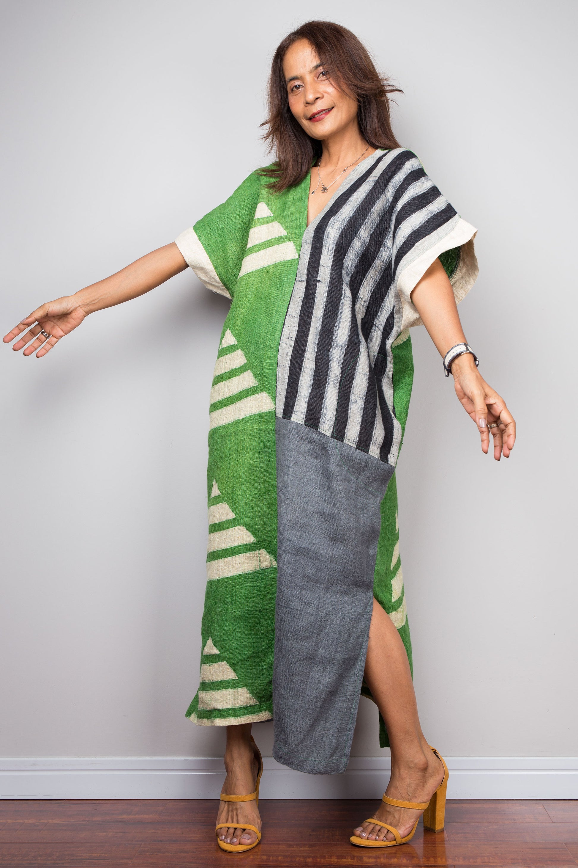 Two tone kaftan dress in grey and green. Caftan style with subtle v neck and pockets on both sides. Geometric pattern in various shapes all over the dress