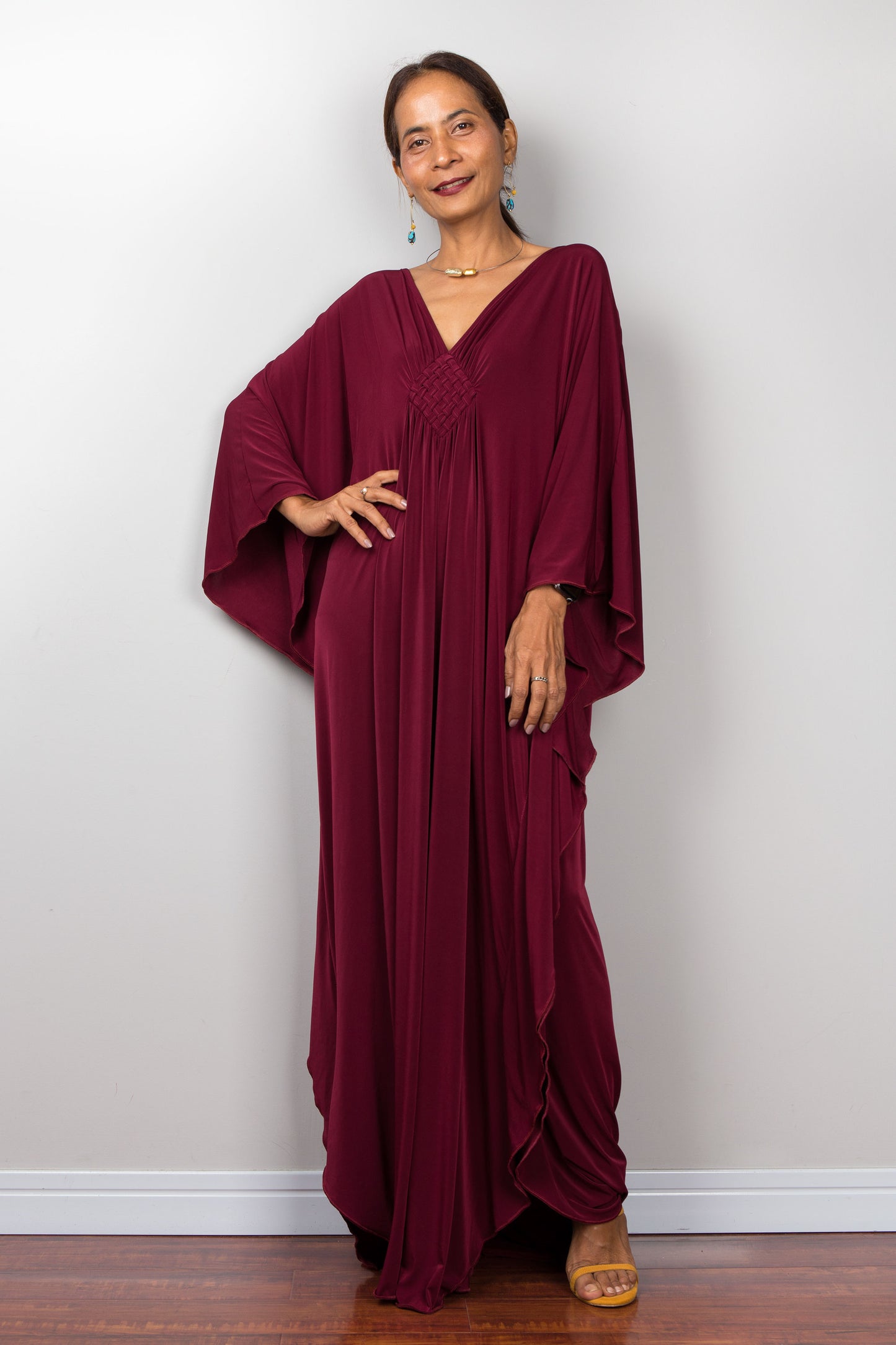 Burgundy caftan - front view - dress with plunging neckline and braided diamond shaped detail on the chest