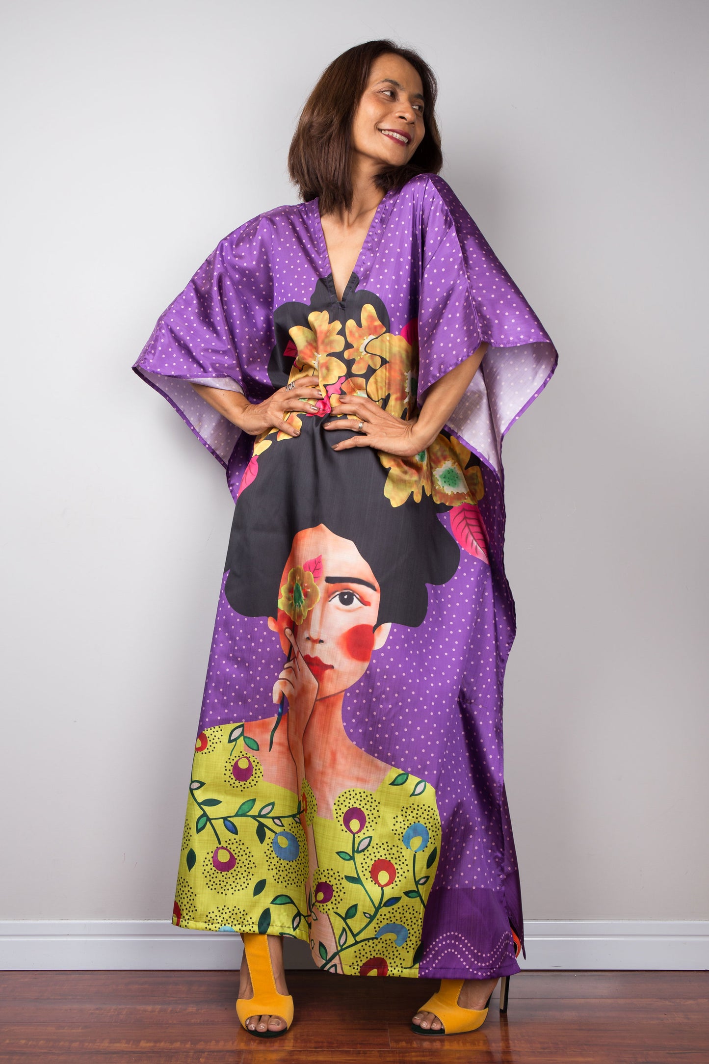 Model wearing luxurious silk kaftan with bold print