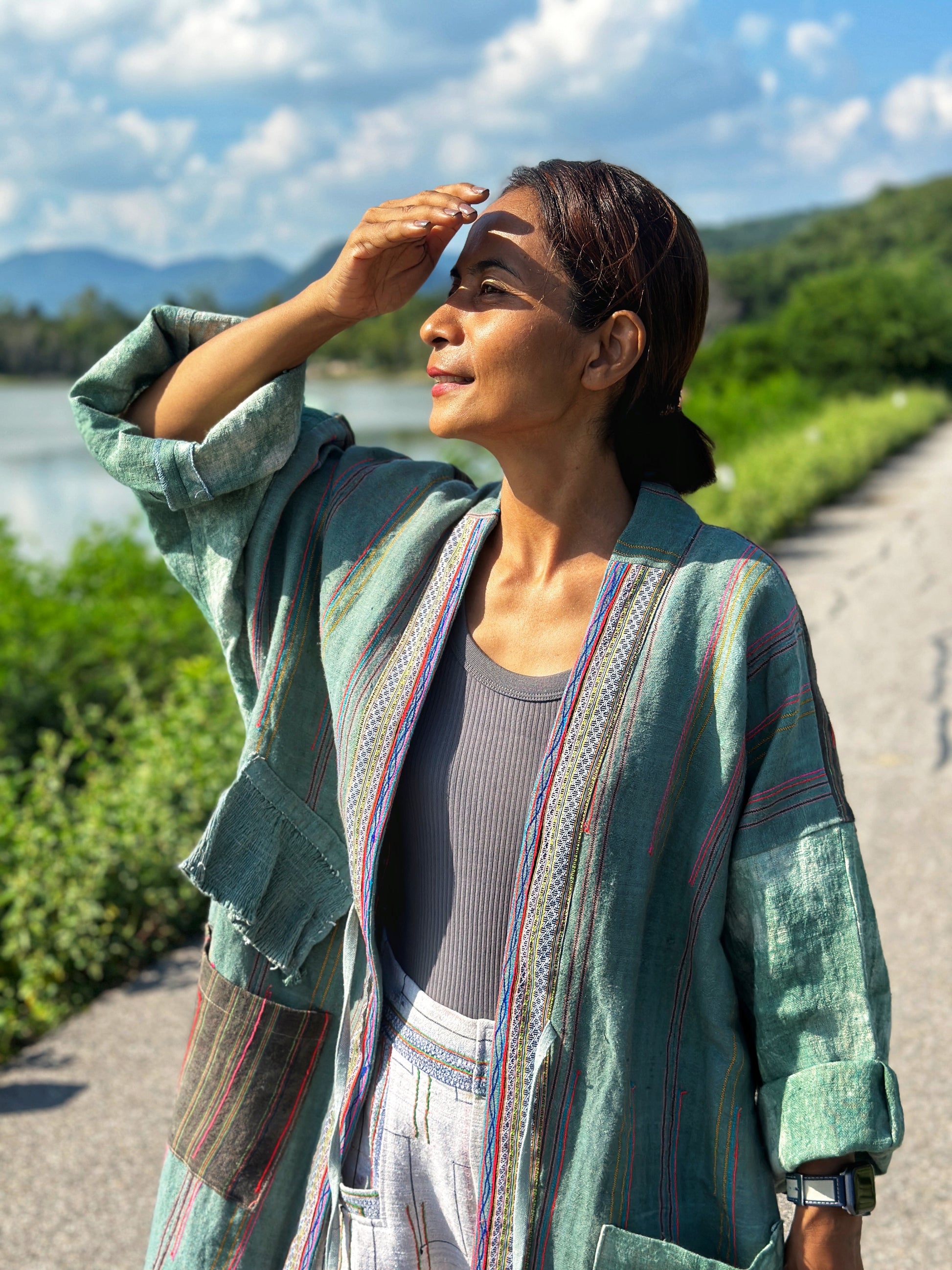 Green handwoven hemp open front cardigan with embroidered pockets