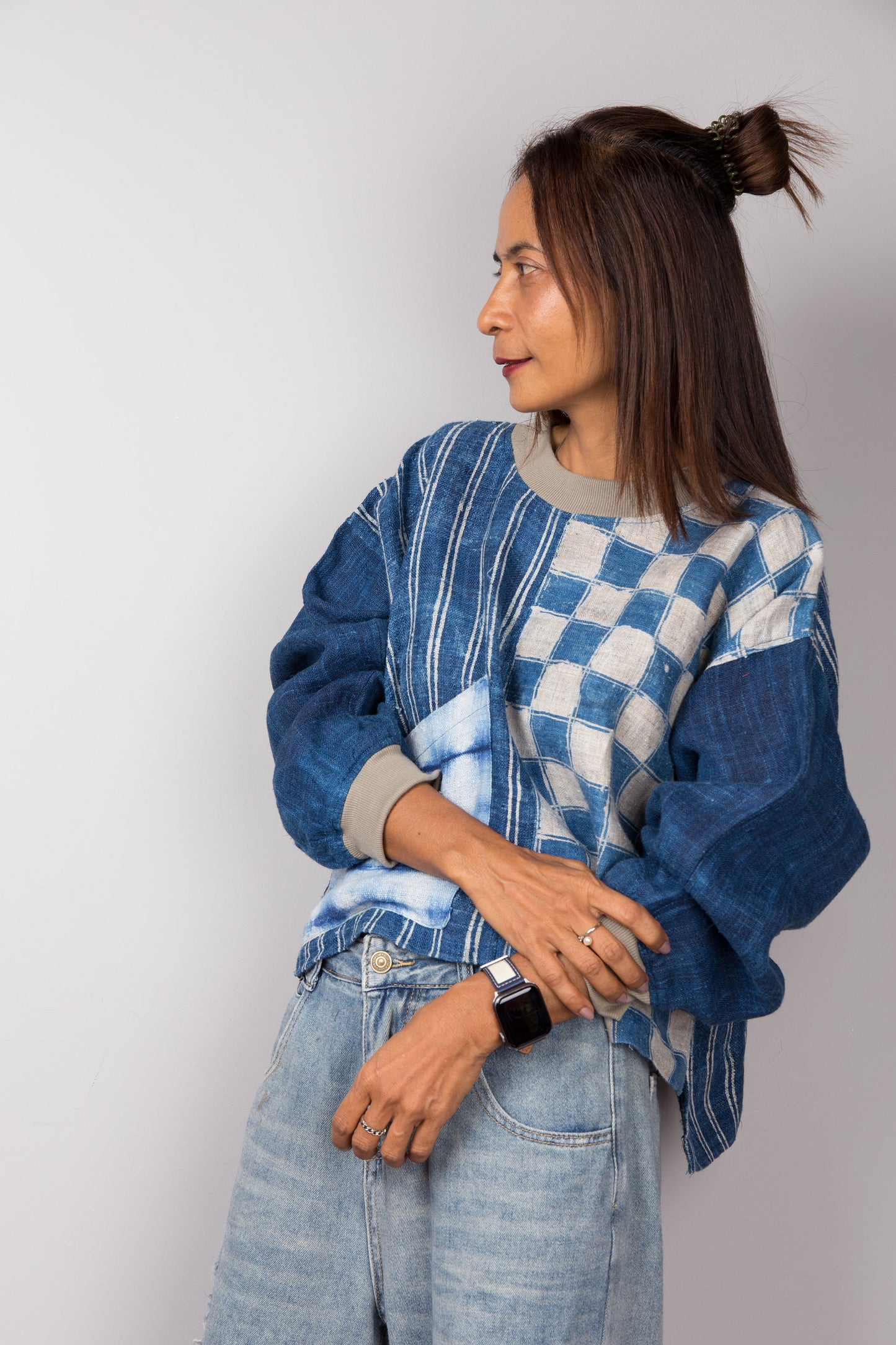 Indigo blue pullover sweater made from handwoven hemp. Crew neck and long sleeves. Side view