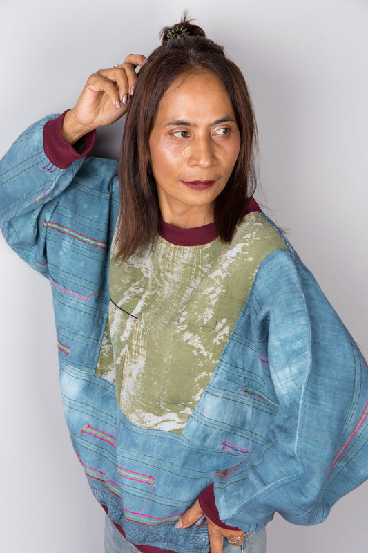 Blue green tie dye sweater made from handwoven hemp.  Crew neck and cuffs are in a burgundy . Original design by Nuichan