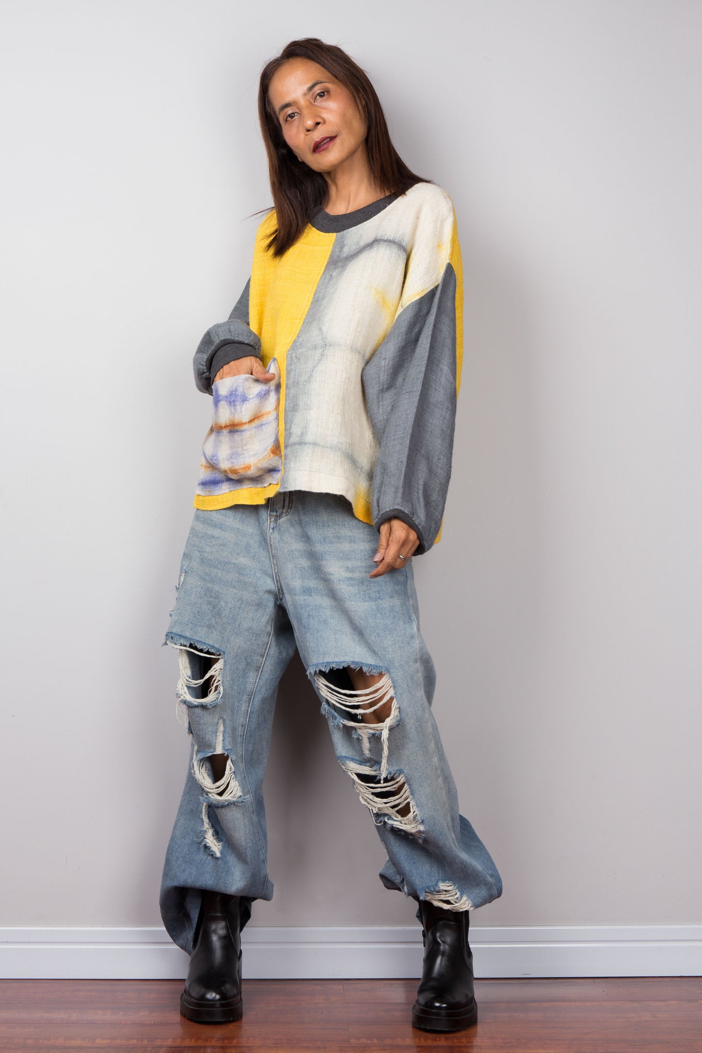 Hemp sweater in yellow and grey with shibori tie dye detail on the front pocket, long sleeves and crew neck