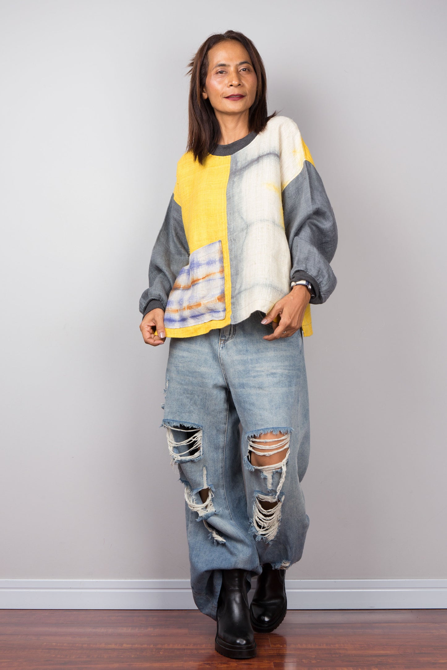 Hemp sweater in yellow and grey with shibori tie dye detail on the front pocket - full body shot