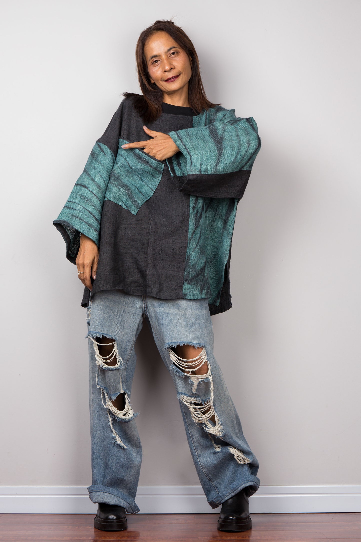 Two tone oversized shirt with big front pocket. Black and green tones with shibori tie dye detail. Full on view.