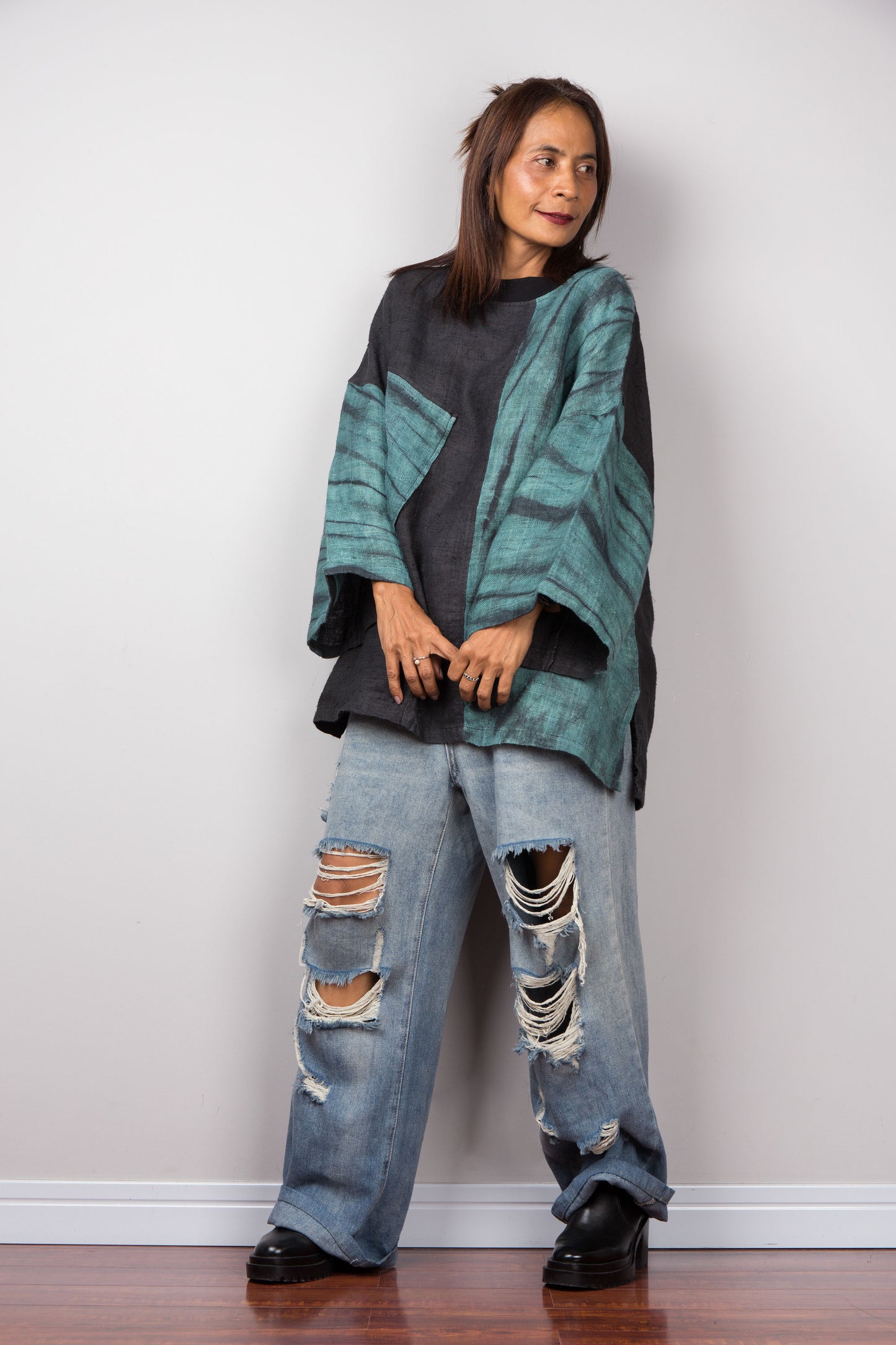 Two tone oversized shirt with big front pocket. Black and green tones with shibori tie dye detail. Frontal view