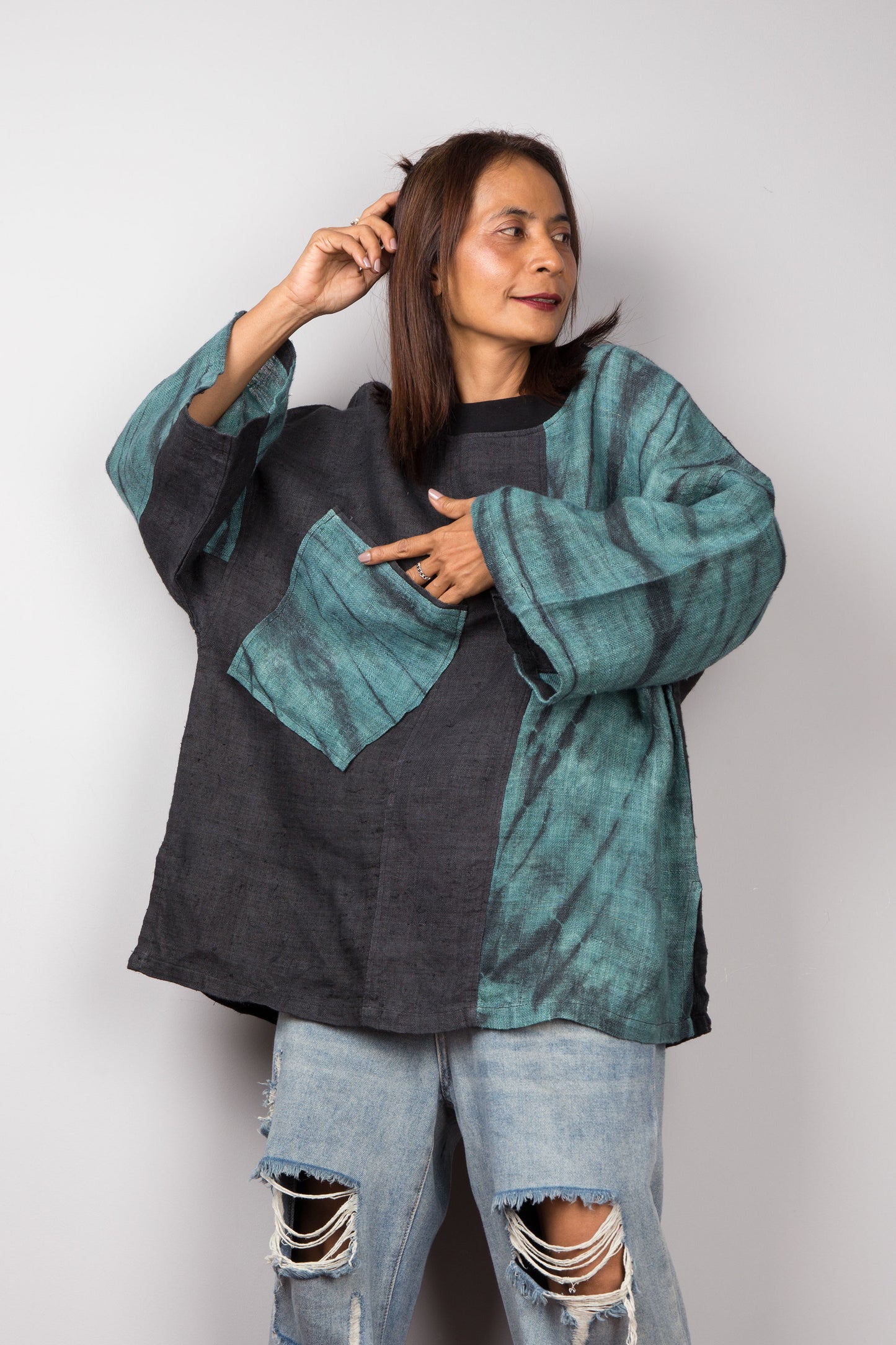 Two tone oversized shirt with big front pocket. Black and green tones with shibori tie dye detail. Big wide sleeves