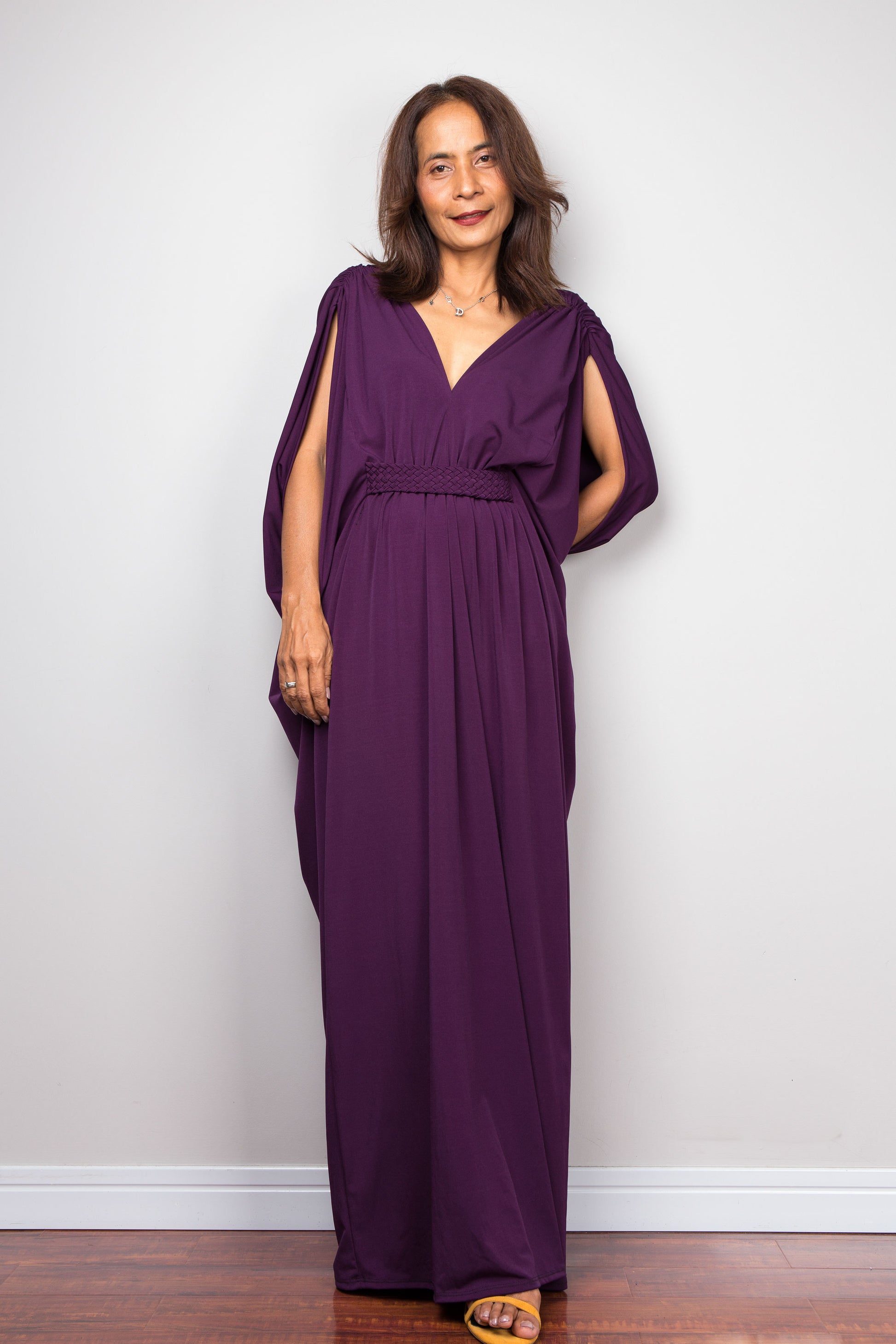 Purple maxi kaftan dress with v neck and braided waist band detail. Front view - Covered arms by batwing sleeve design view