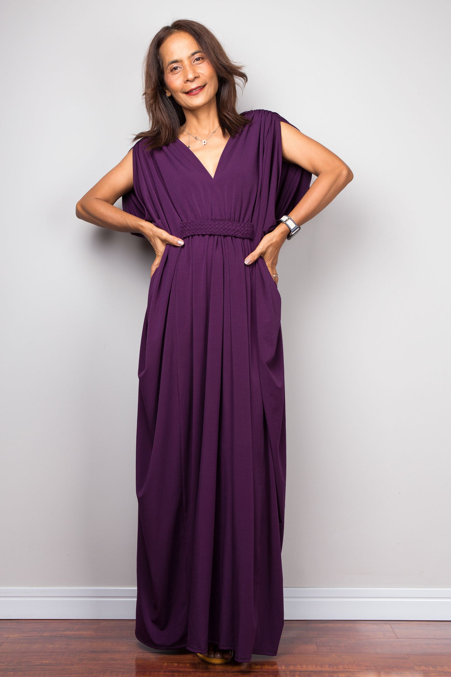 Purple maxi kaftan dress with v neck and braided waist band detail. Front view