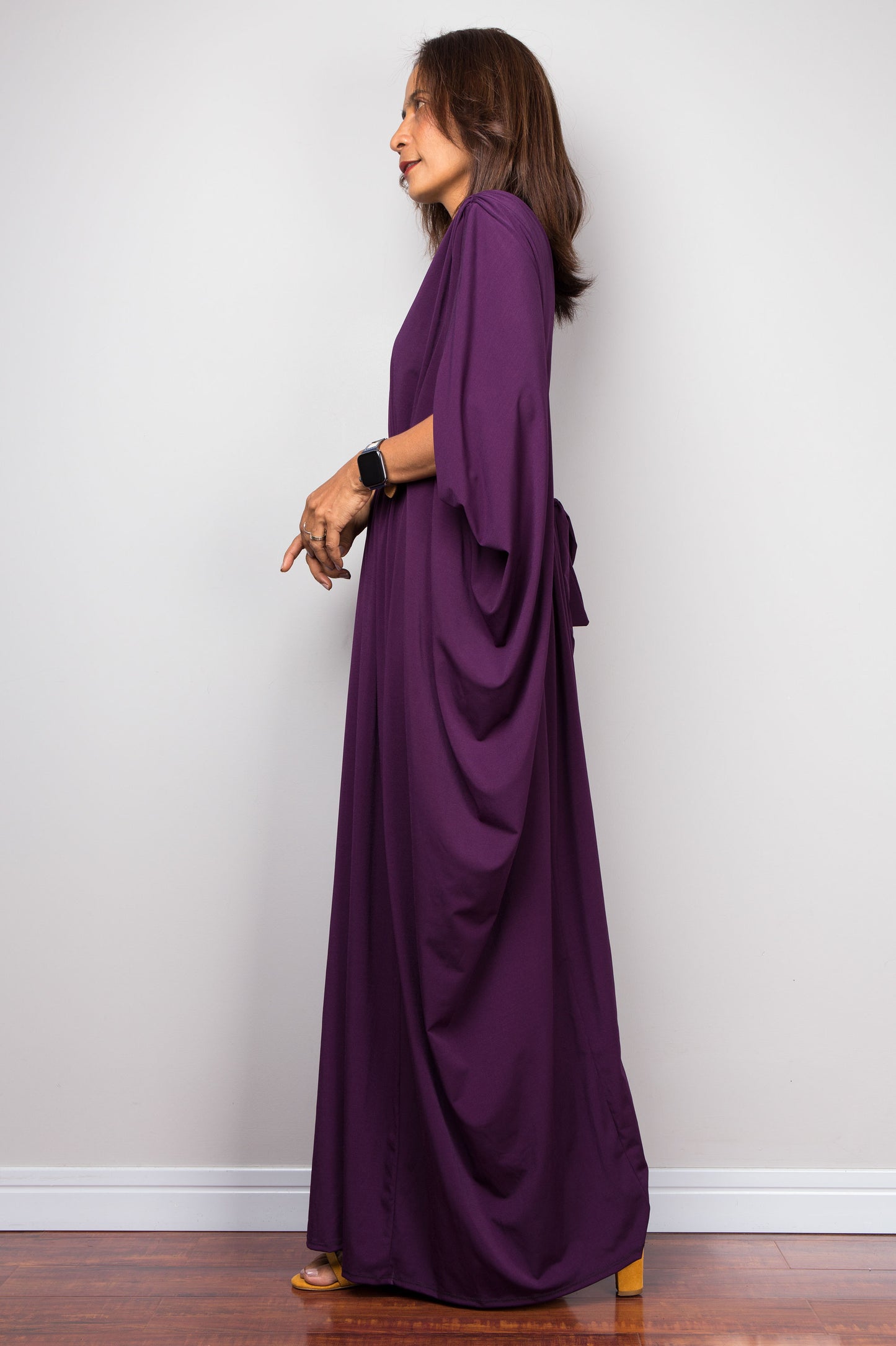 Purple maxi kaftan dress with v neck and braided waist band detail. Side view