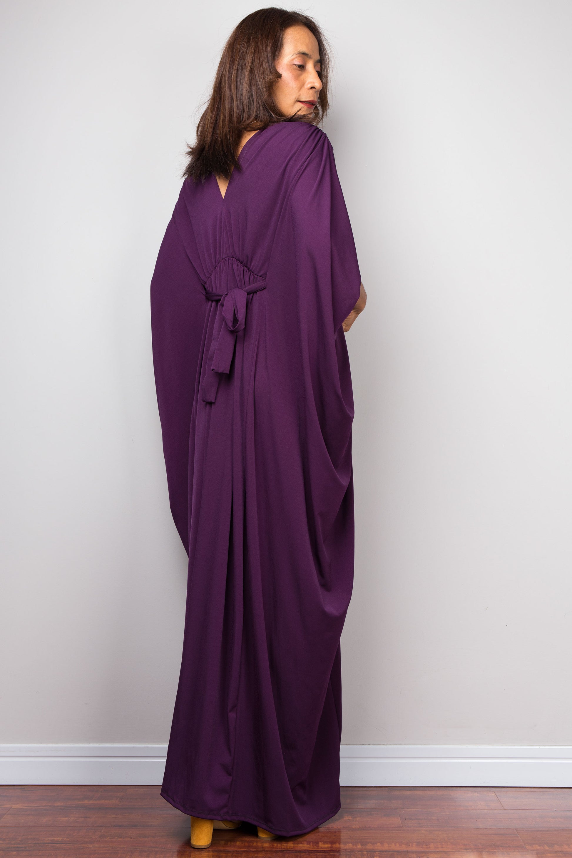 Purple maxi kaftan dress with v neck and braided waist band detail. Back view