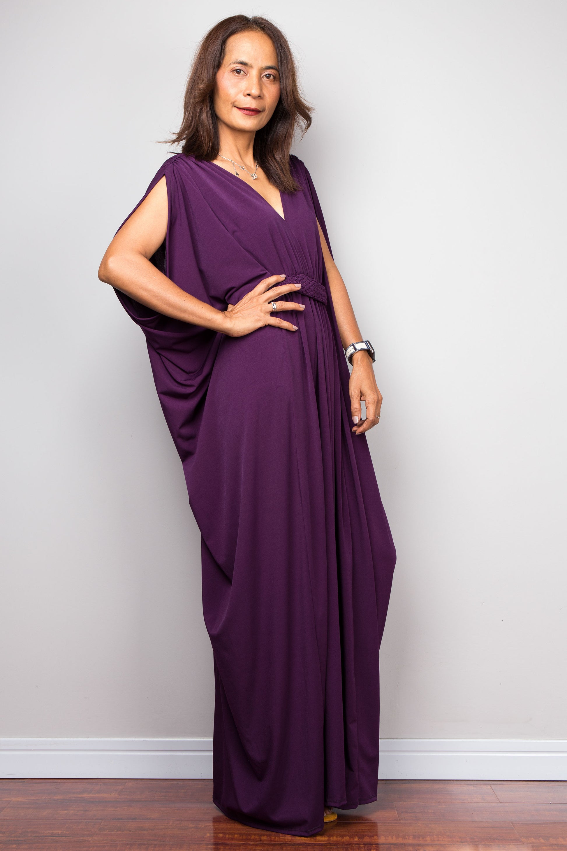 Purple maxi kaftan dress with v neck and braided waist band detail. Side view - batwing sleeve design