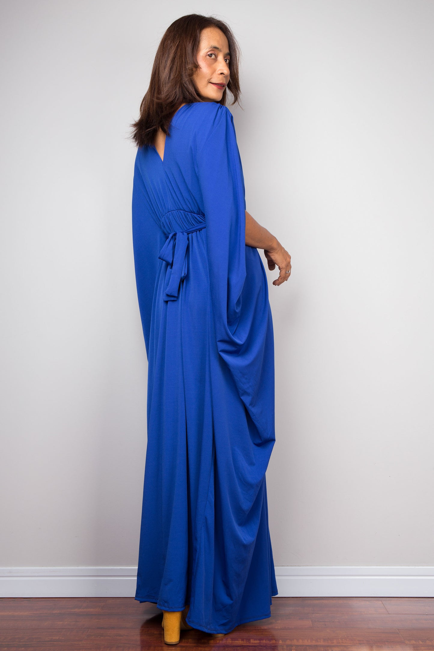 Royal blue kaftan dress with braided waist detail. V neck and batwing sleeve design. Back View