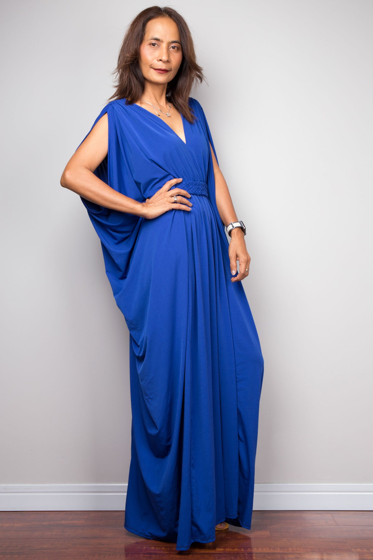 Royal blue caftan dress with braided waist detail. V neck and batwing sleeve design. High waist dress