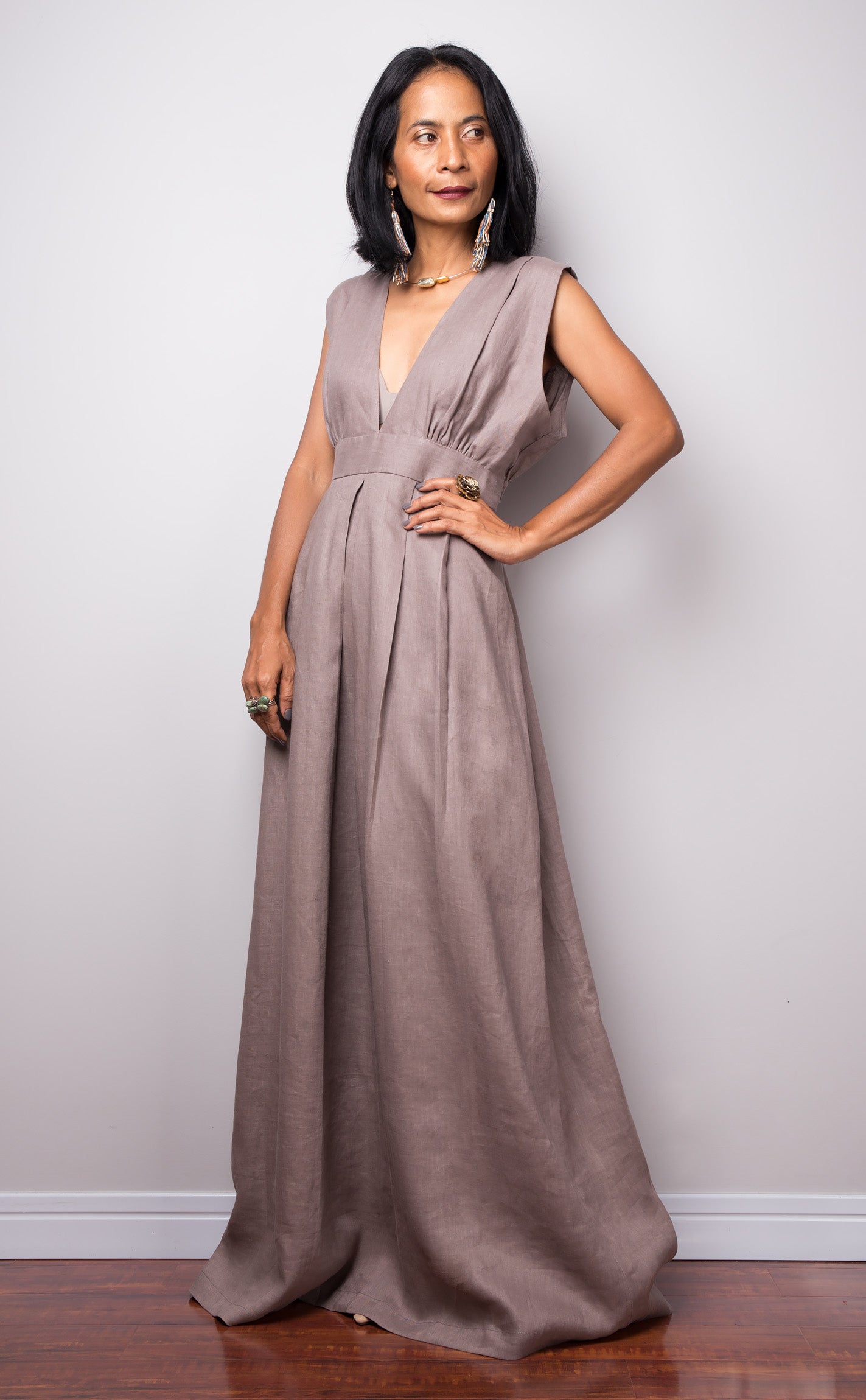 Taupe sleeveless dress with plunging neckline.  High waist design by Nuichan. Side view.