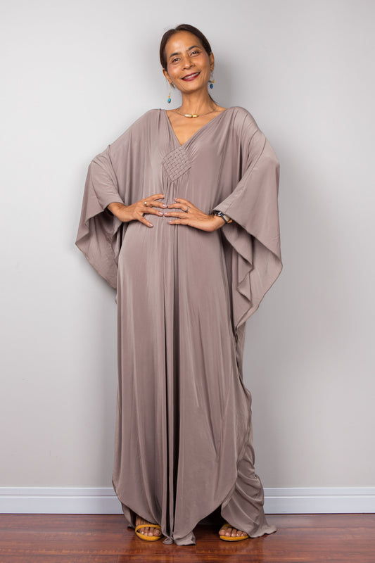 Taupe kaftan maxi dress with batwing sleeves and plunging neckline.  Design by Nuichan