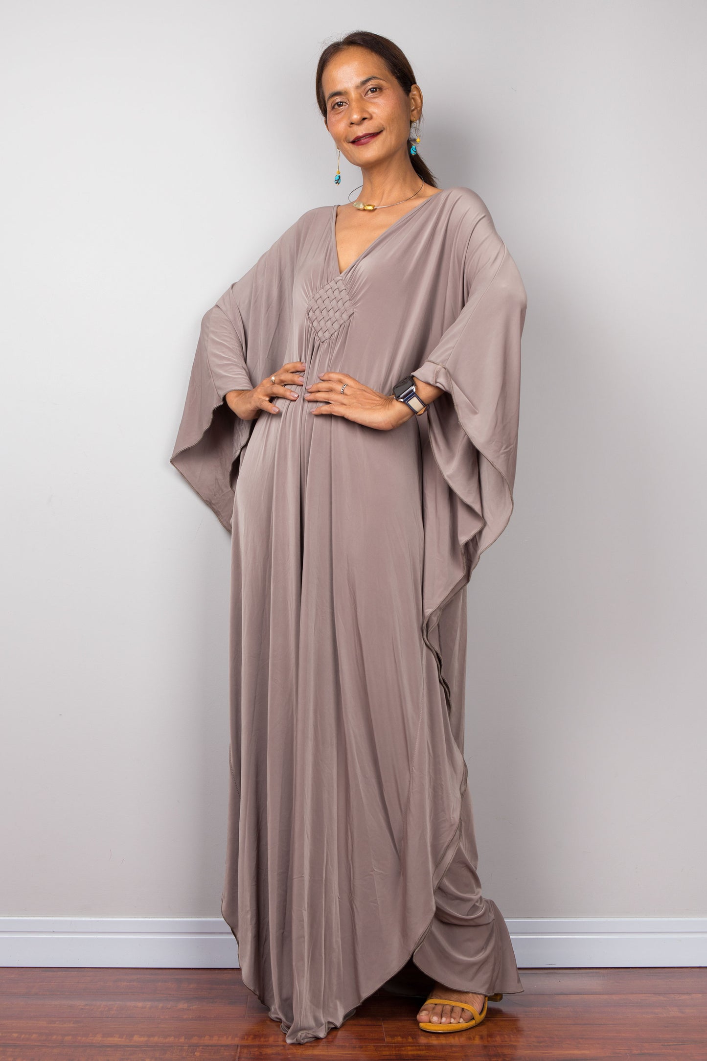 Taupe caftan maxi dress.  Plunging neckline and braided diamond shaped detail on the chest