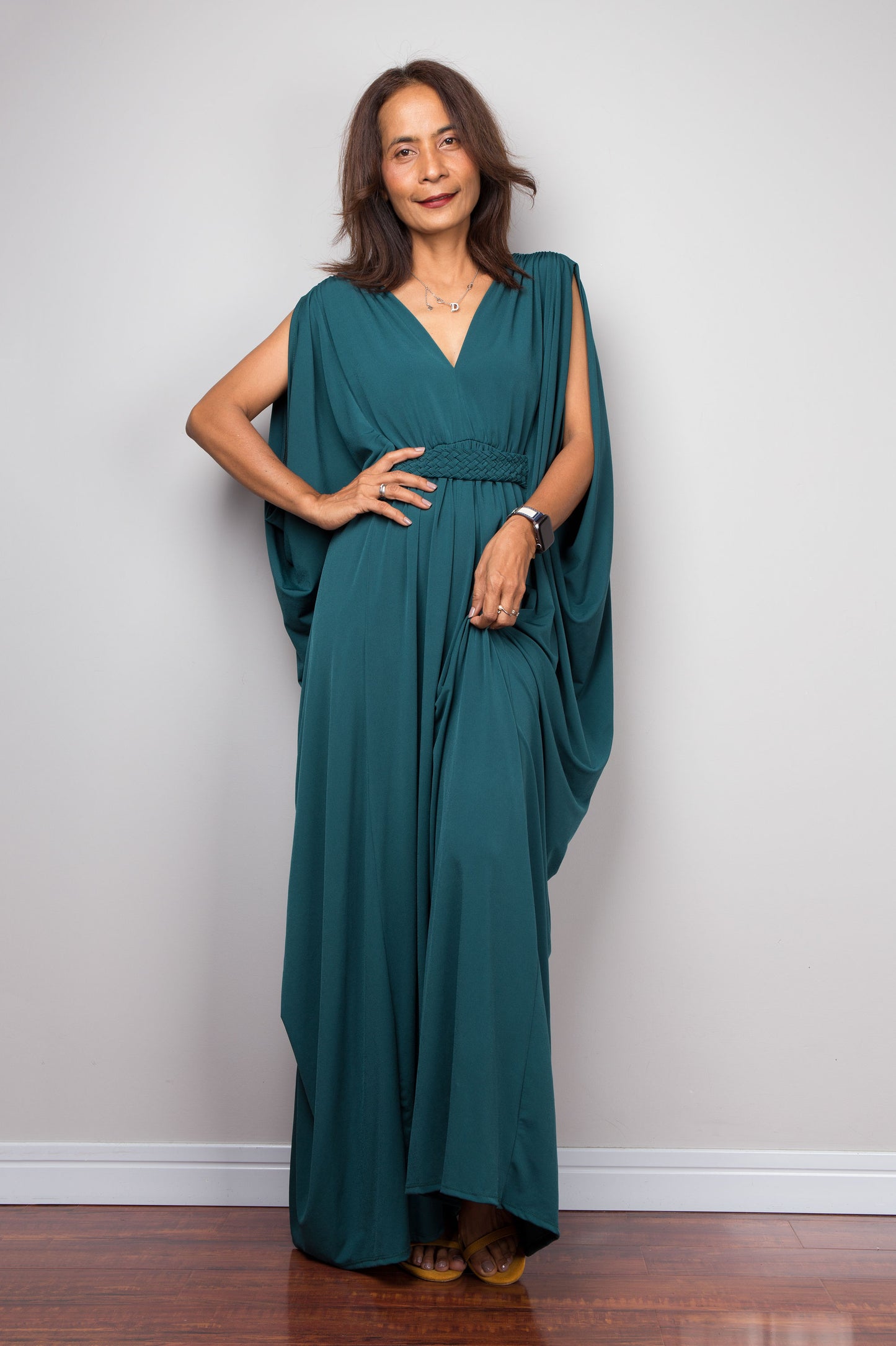 Teal caftan maxi dress with v neck and braided detail on the waist.