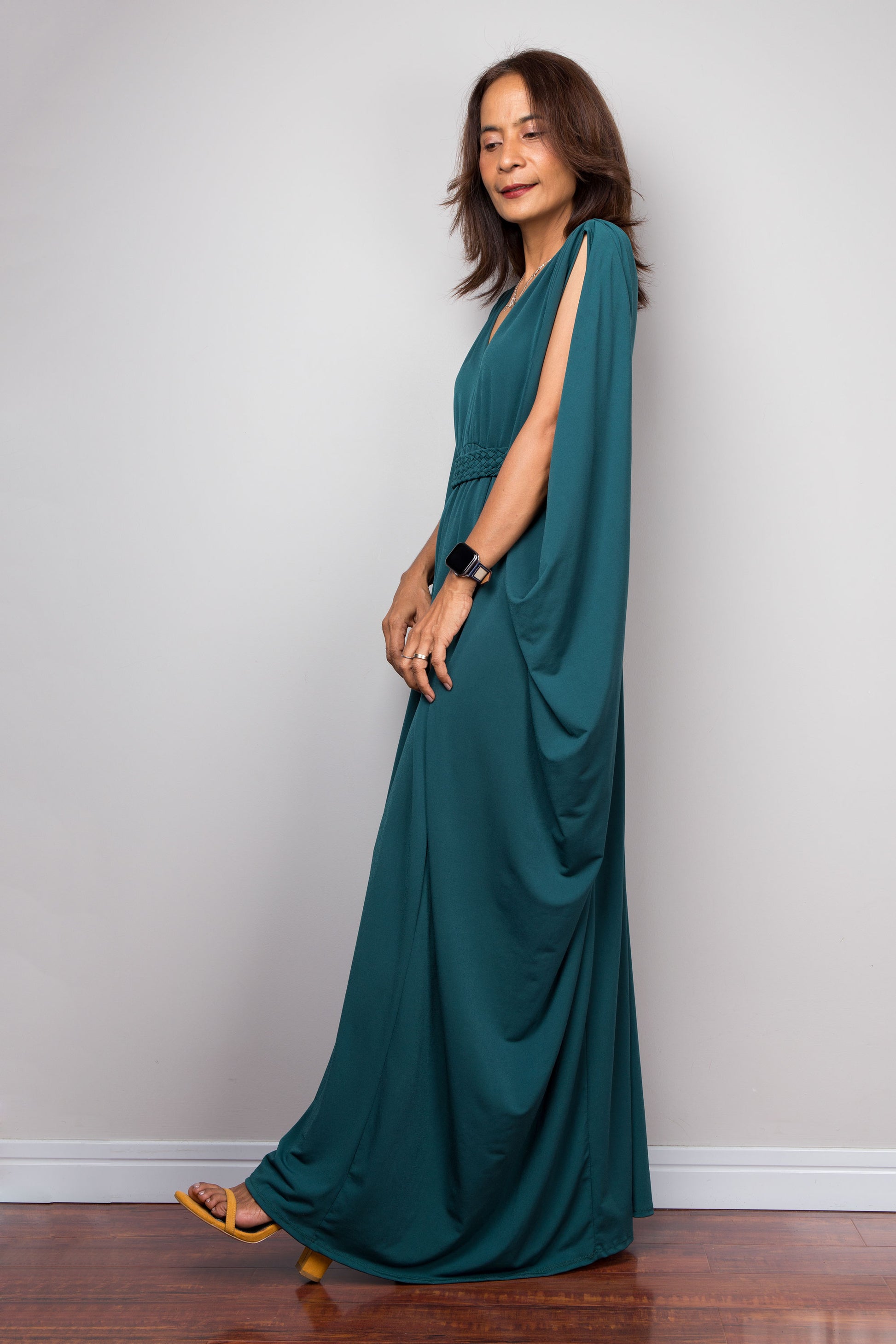 Teal kaftan maxi dress with v neck and braided detail on the waist. Side view batwing sleeve design