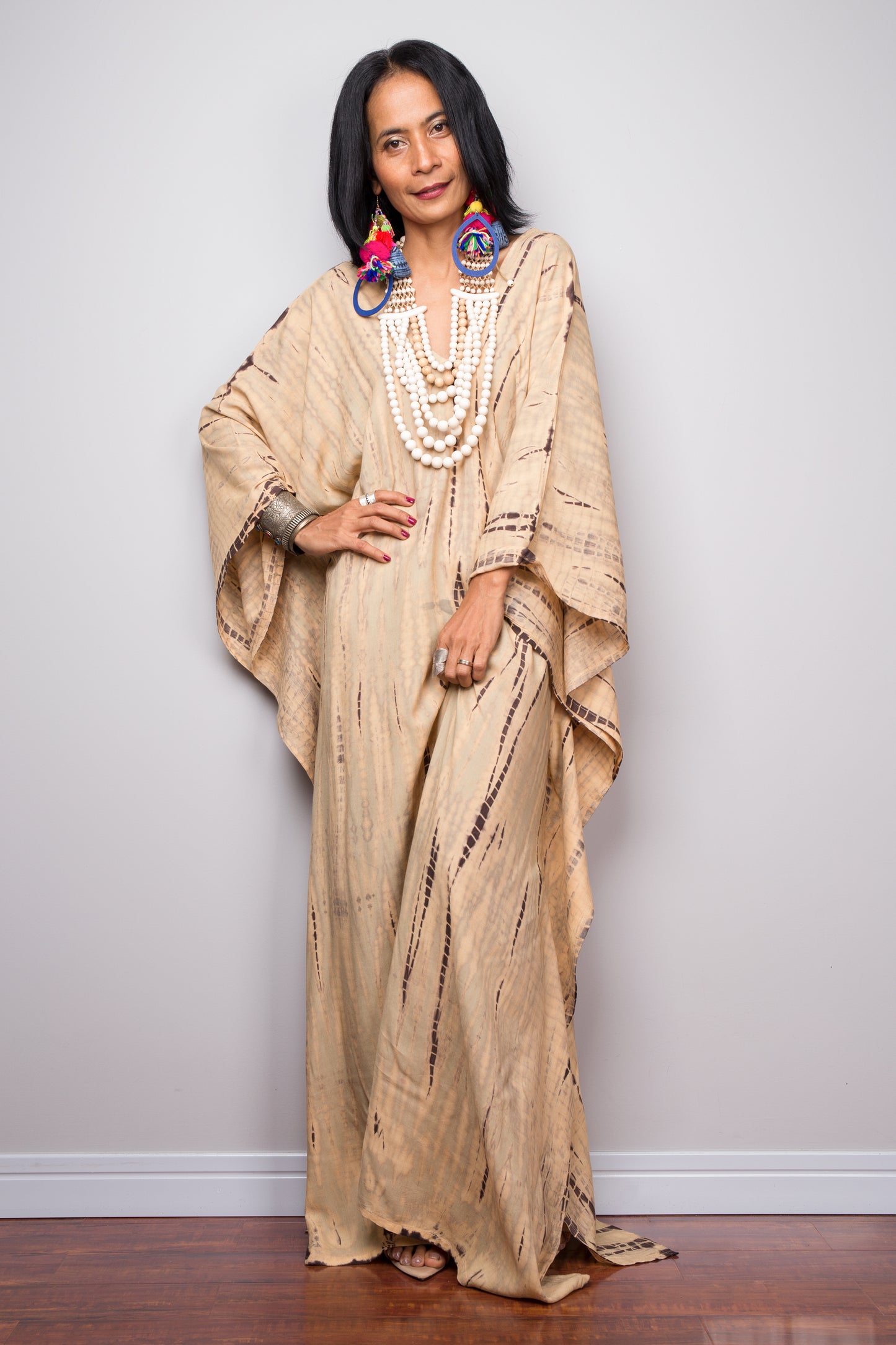 Tie dye beach kaftan with v neck and batwing sleeves. Large loose fitting dress with splits.