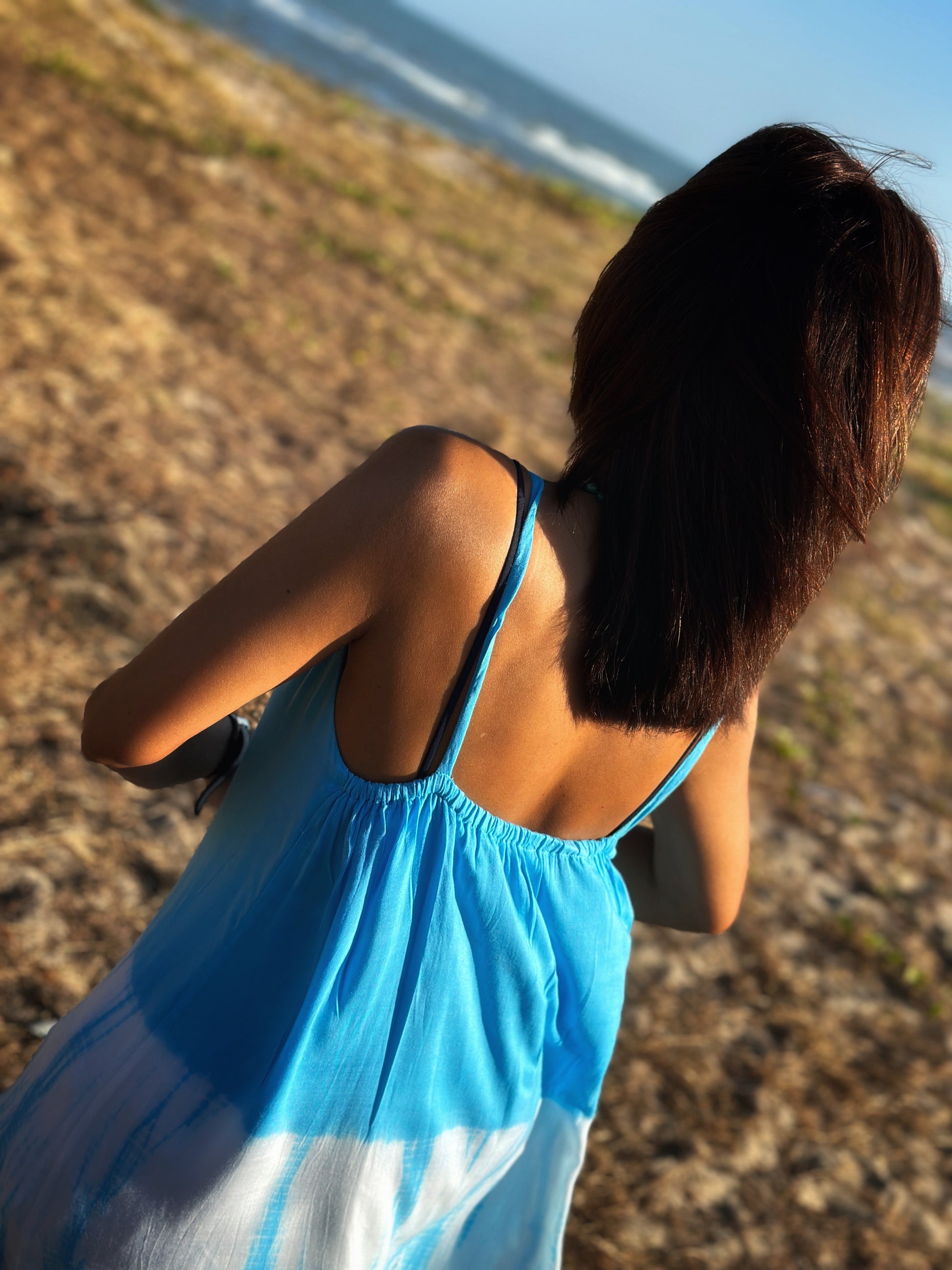 Detail back shot of the light blue shibori pattern, emphasizing the handcrafted beauty of the dress