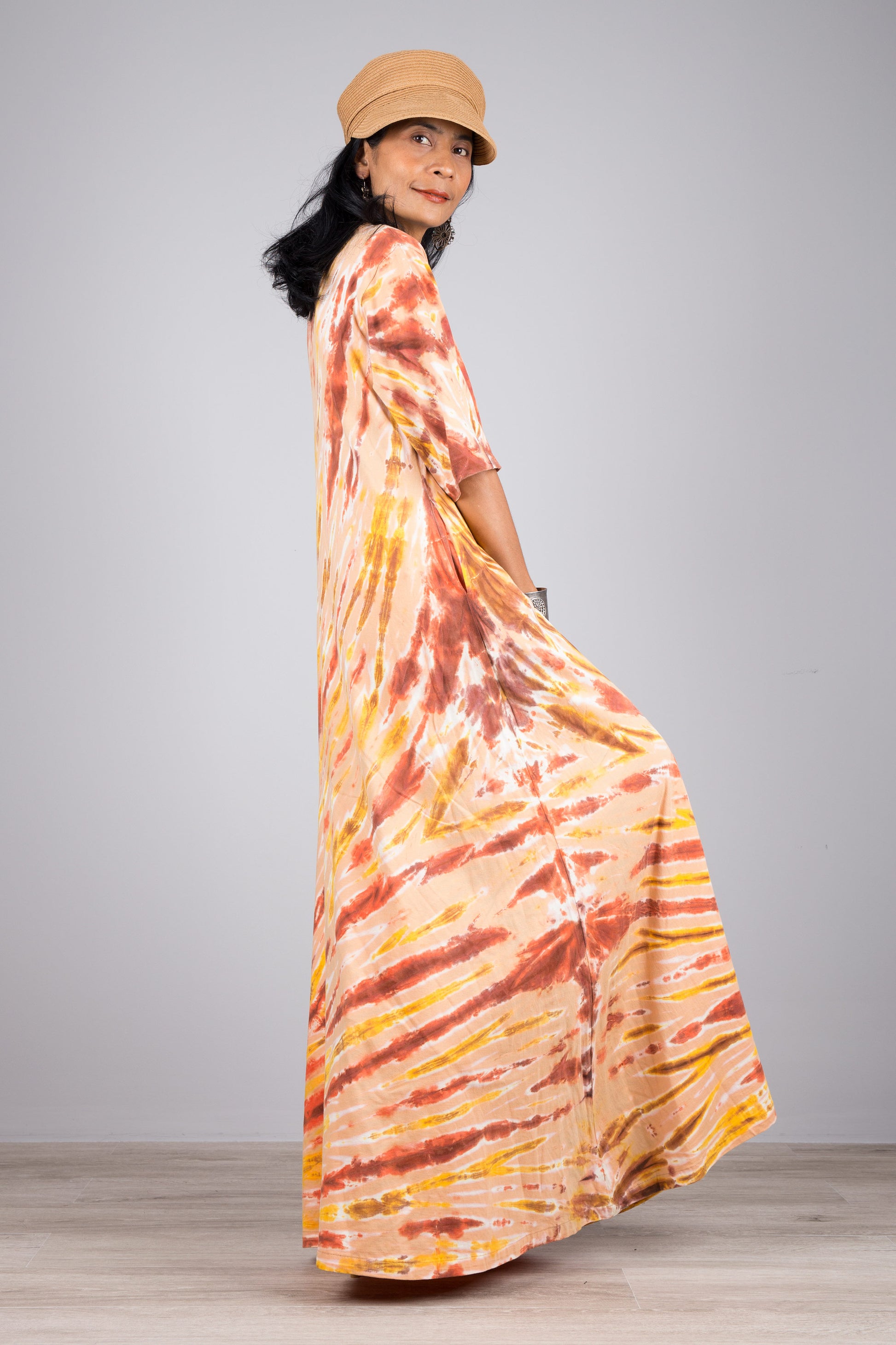 Tie dye dress in orange.  Maxi dress style with mid length sleeves. Nuichan tie dye