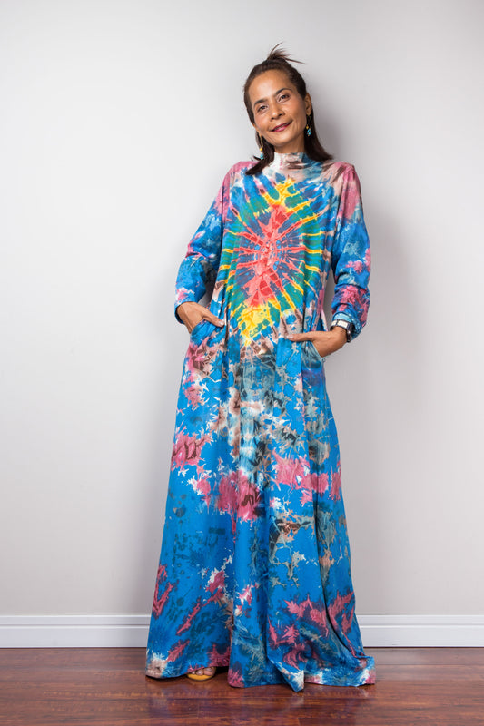 Long sleeve tie dye maxi dress with inseam pockets and short mock turtle neck.