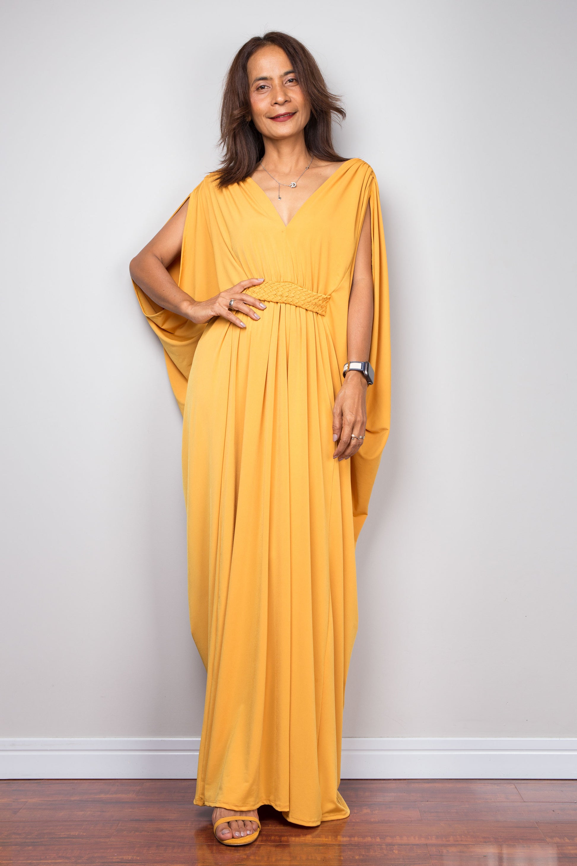 Yellow kaftan maxi dress with braided waist detail and v neck. Front view