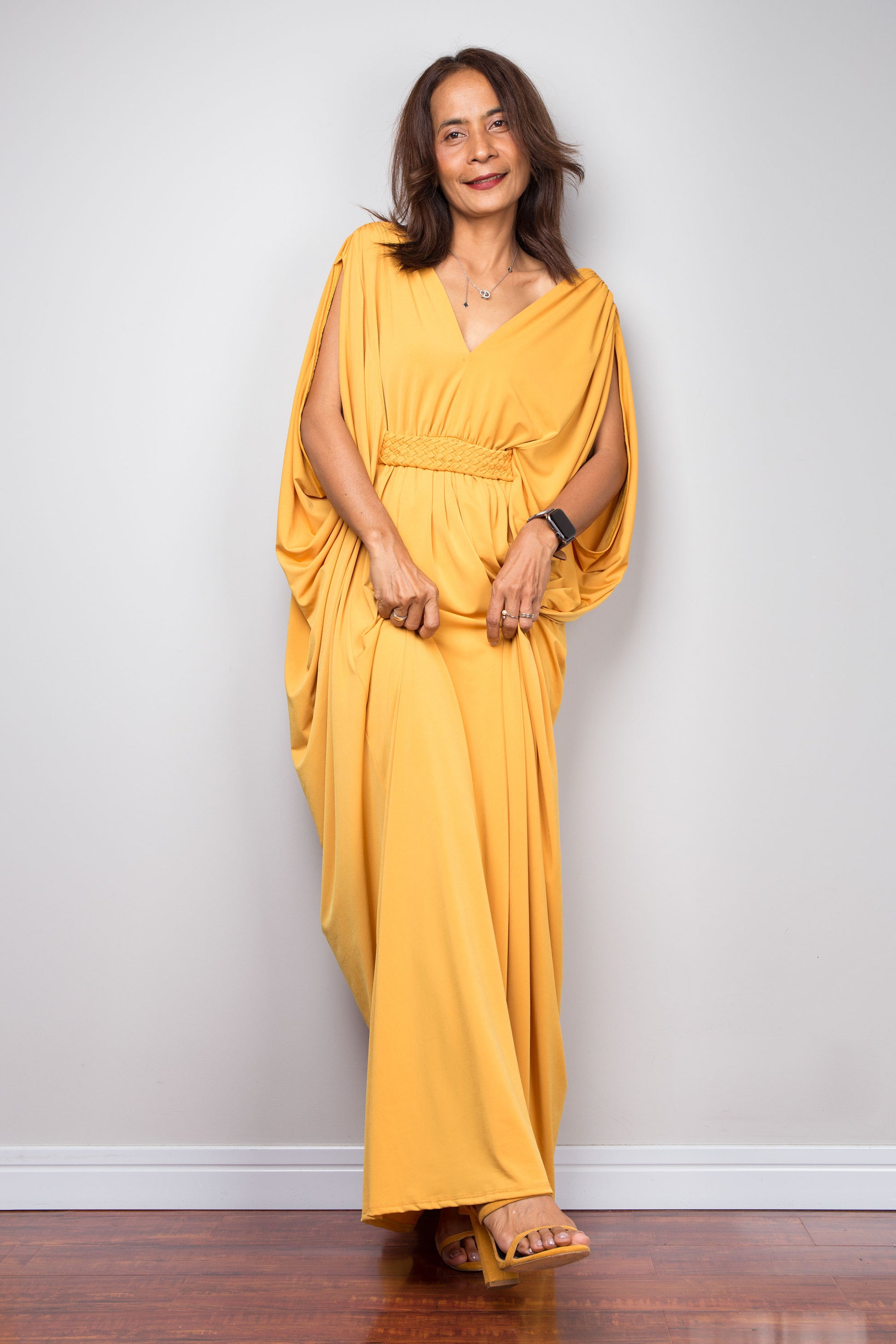 Yellow kaftan goddess dress with braided waist detail and v neck. Front view