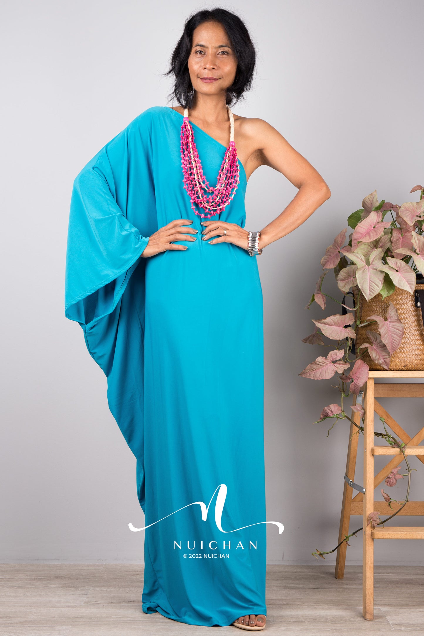 Blue one shoulder kaftan dress with batwing sleeve. Design by Nuichan