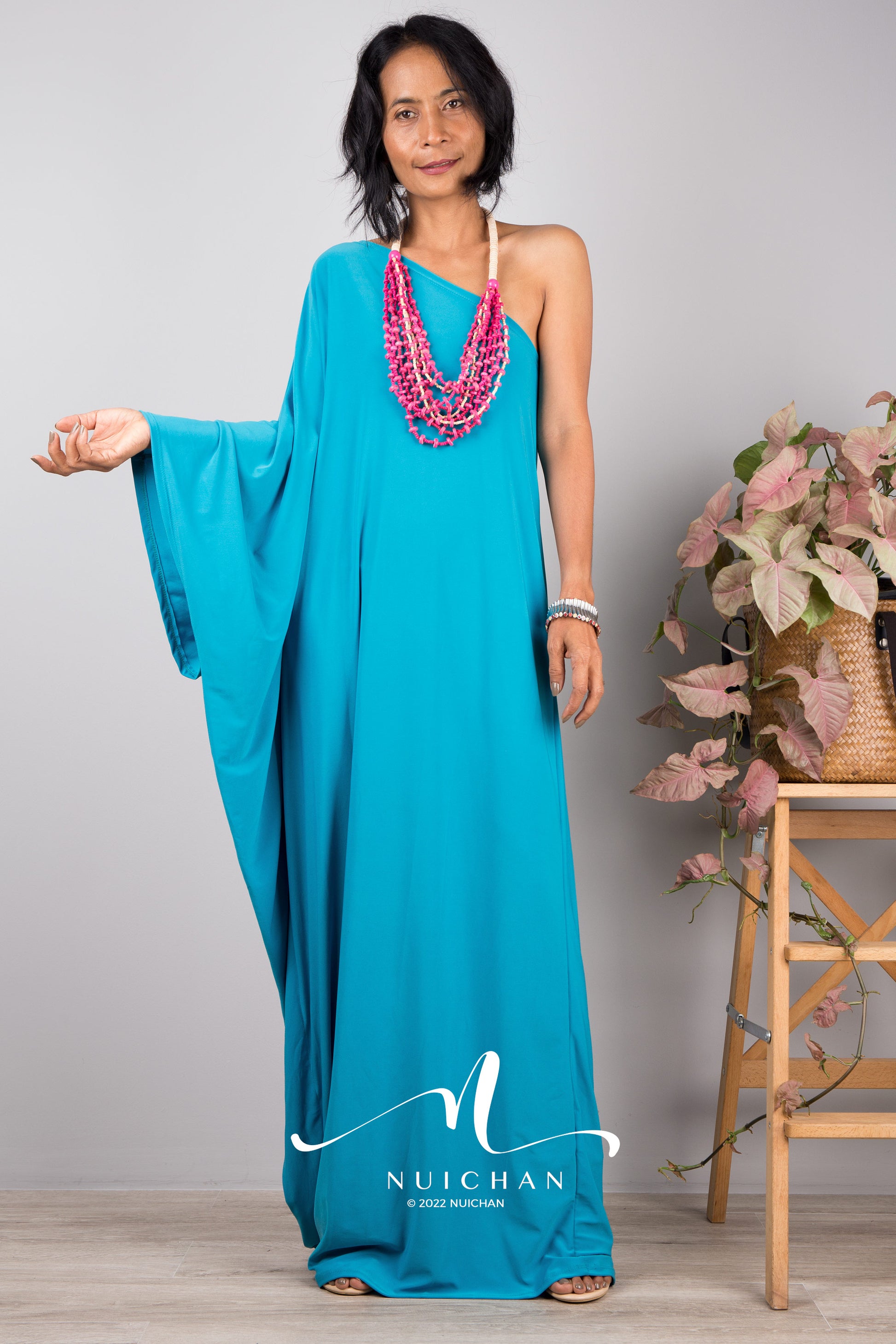 Aqua Blue one shoulder dress with batwing sleeve.  Nuichan design