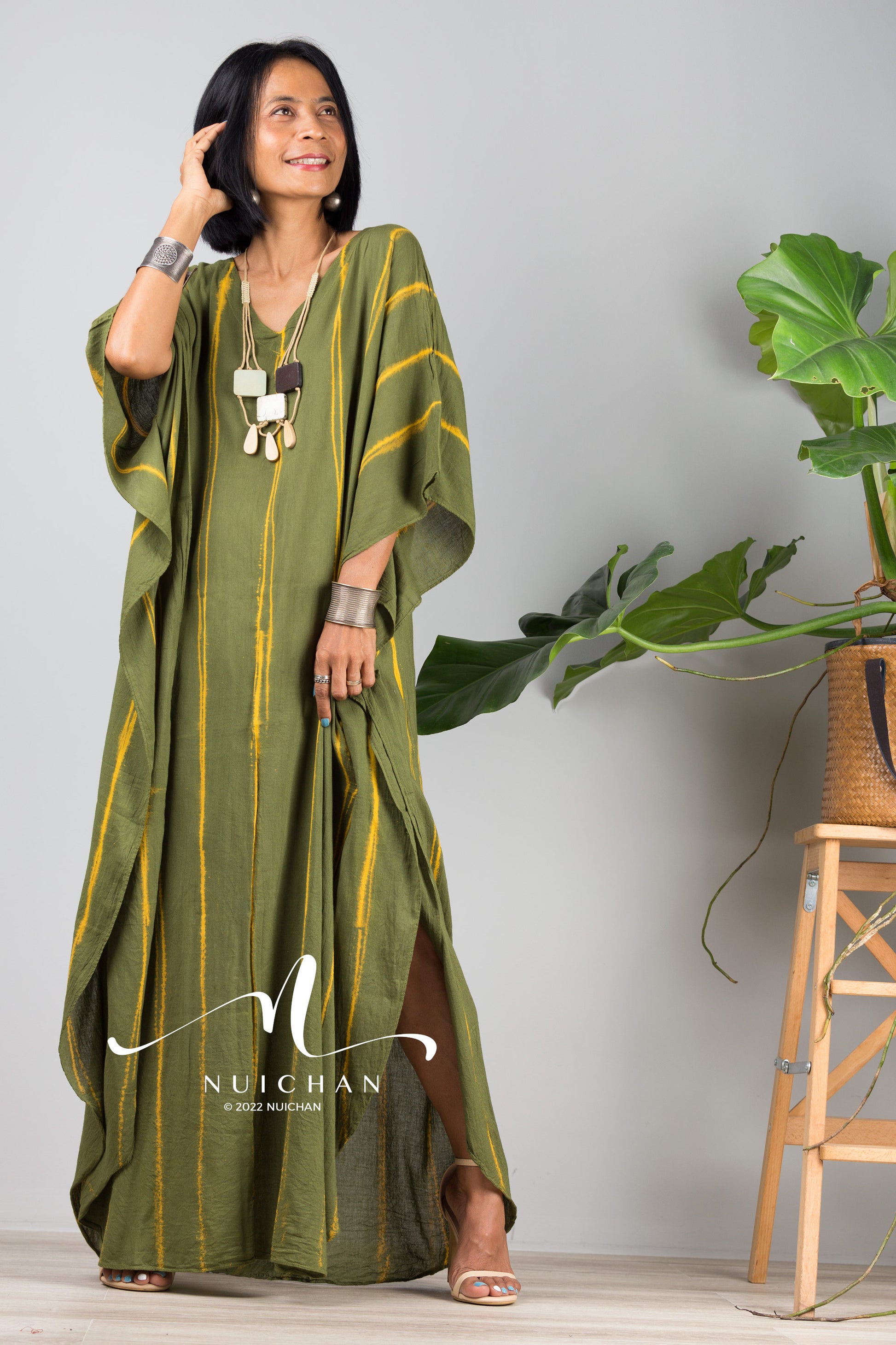 Green Tie dye kaftan. Front view of dress with long vertical stripes