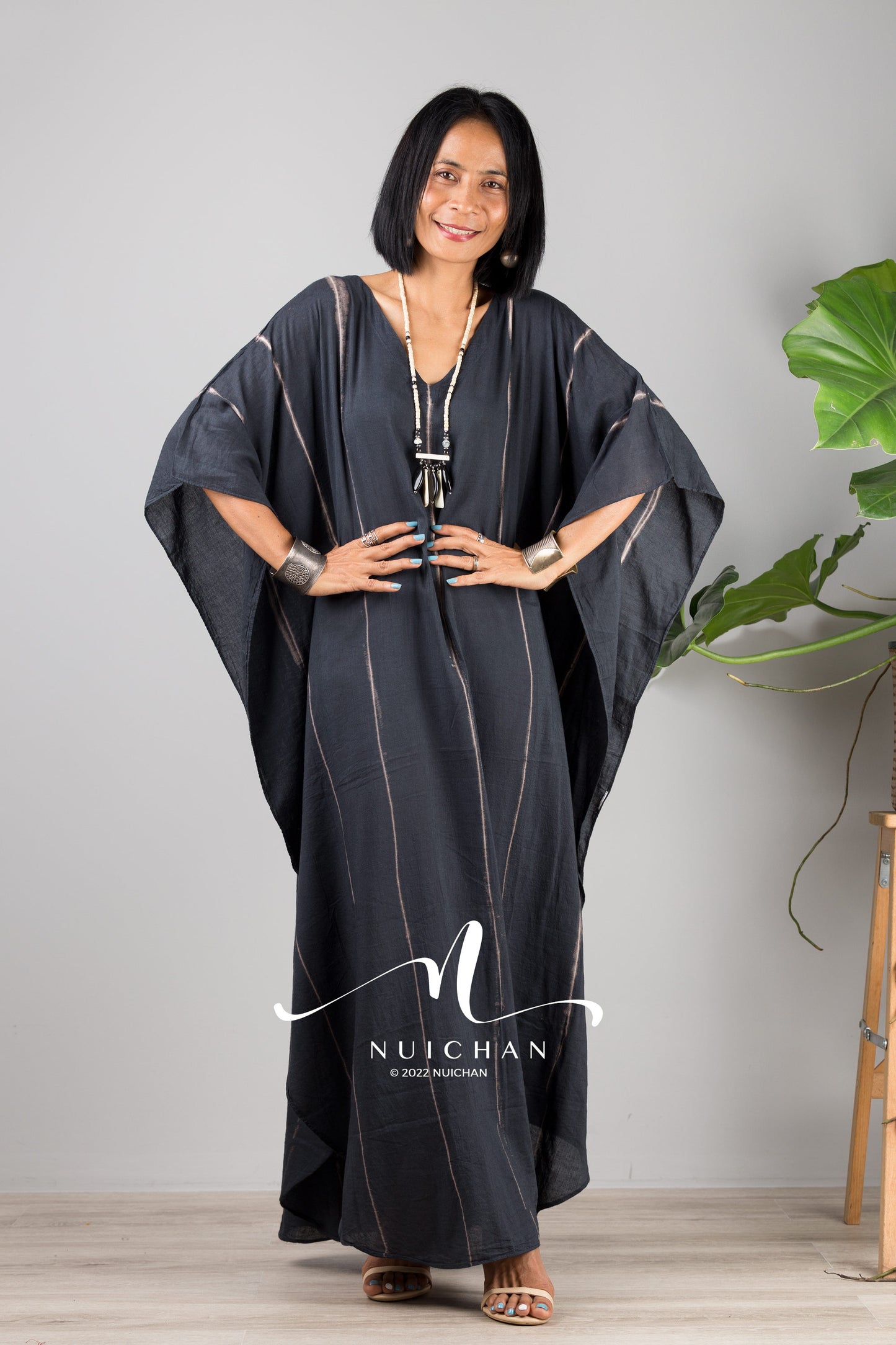 Nuichan Women Tie dye kaftan. Long black dress with batwing sleeves and vertical stripes