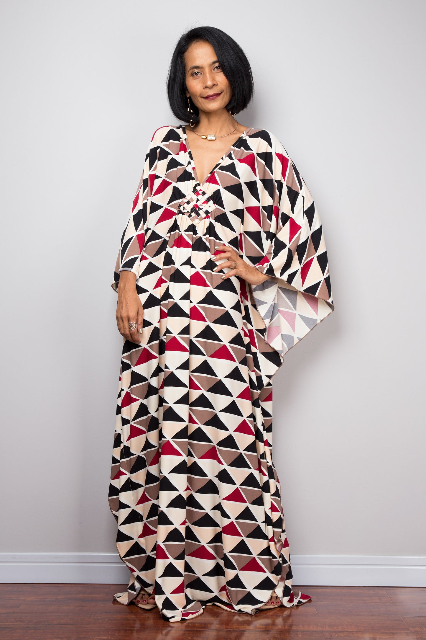 Batwing sleeve kaftan dress with triangular print.