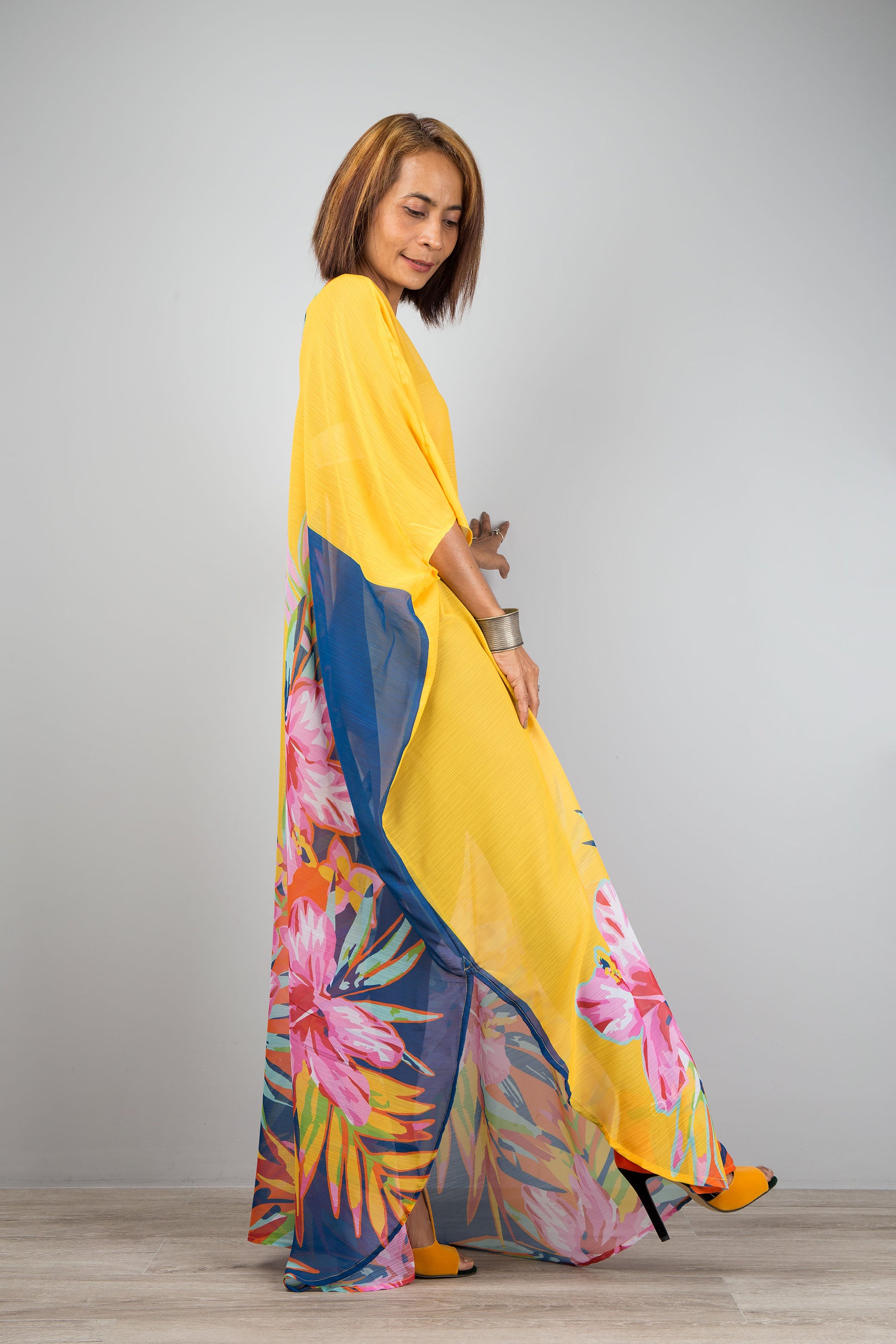 Yellow chiffon kaftan maxi dress with v neck.  See through beach dress with big floral print on the side. Design by Nuichan