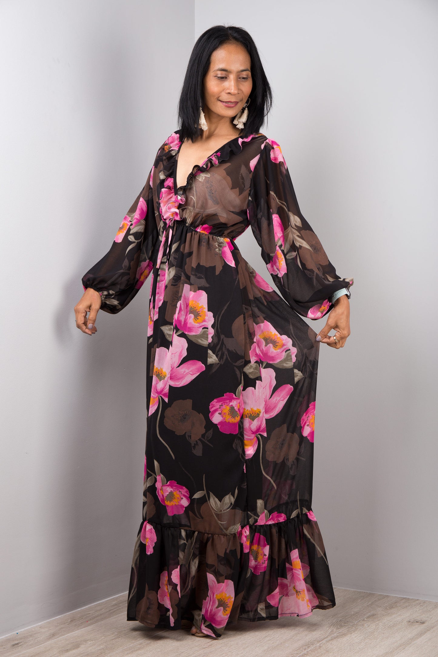 Black chiffon dress with pink floral print. Plunging v neck line with ruffles.