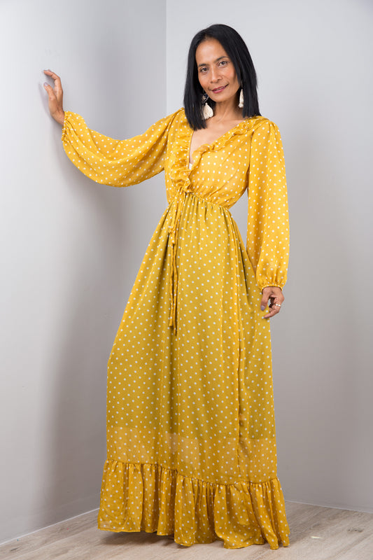 Yellow chiffon maxi dress with long sleeves and ruffle at the bottom hem