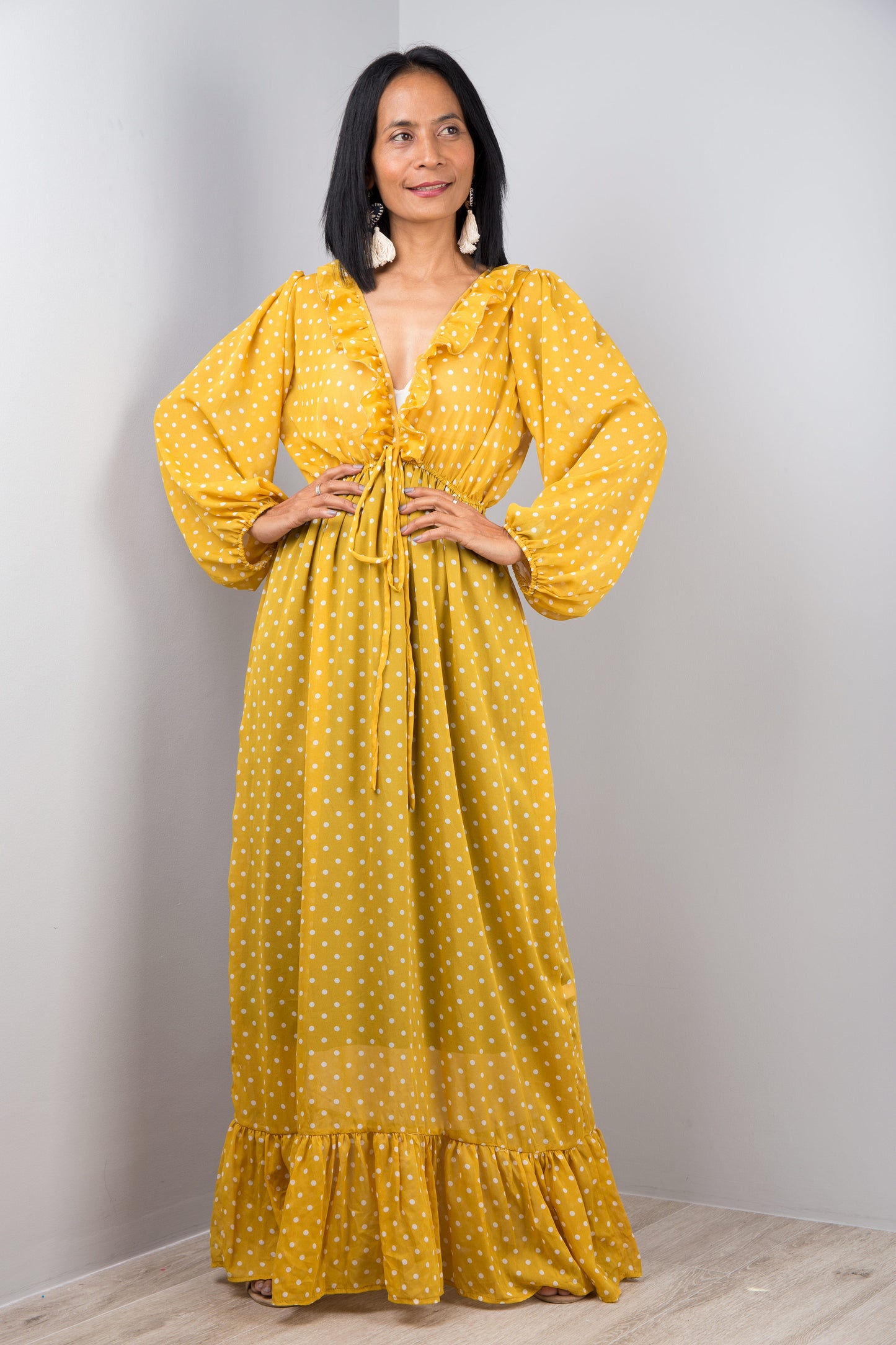 Yellow chiffon dress with plunging neckline.  Ruffle on the bottom hem and drawstring at the waist