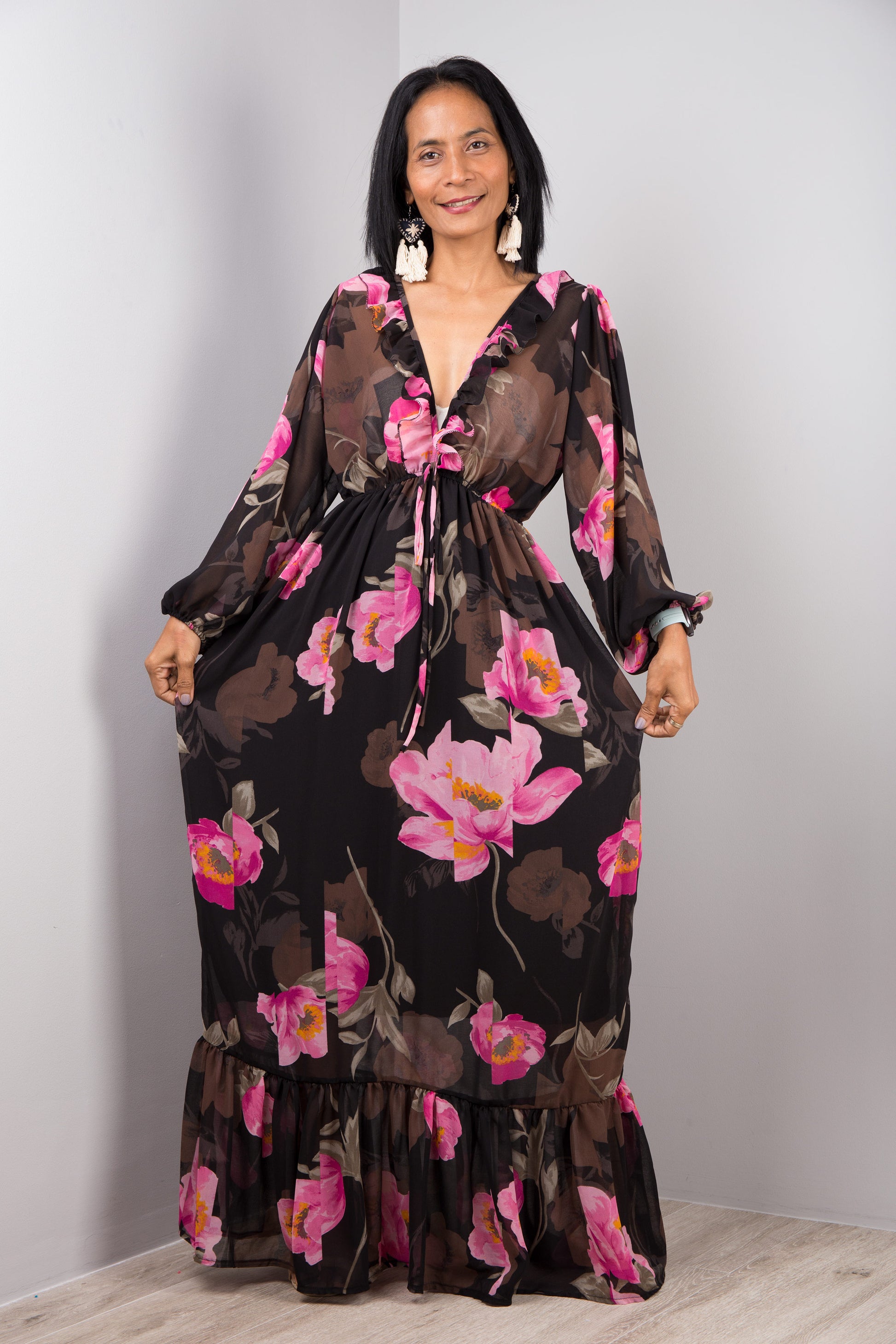 Pink floral dress in a sheer chiffon fabric. Long sleeve dress with deep v neckline