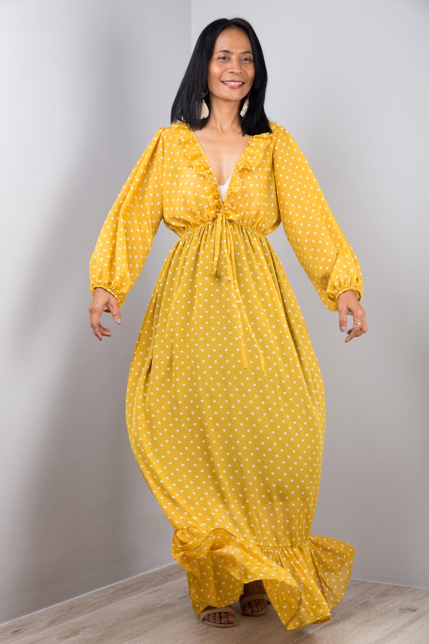 Long flowy chiffon maxi dress in yellow with polka dot print.